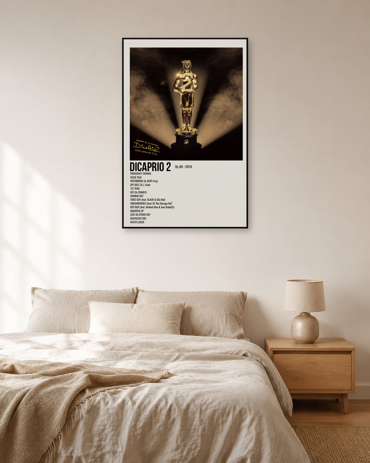 JID DiCaprio 2 Cream Vertical Tracklist Poster — natural-light bedroom display. Print sold unframed; frame for display only.