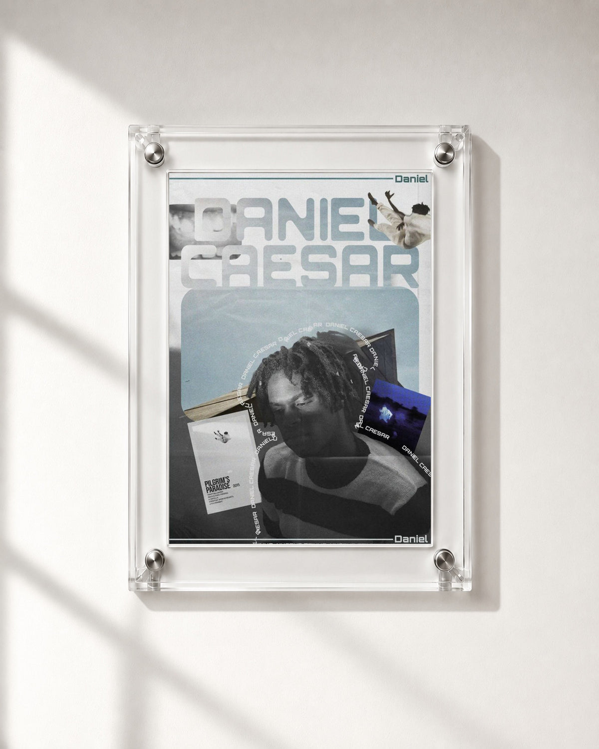 Daniel Caesar Blue Album Collage Poster, close-up display. Frame for display only; poster sold unframed.