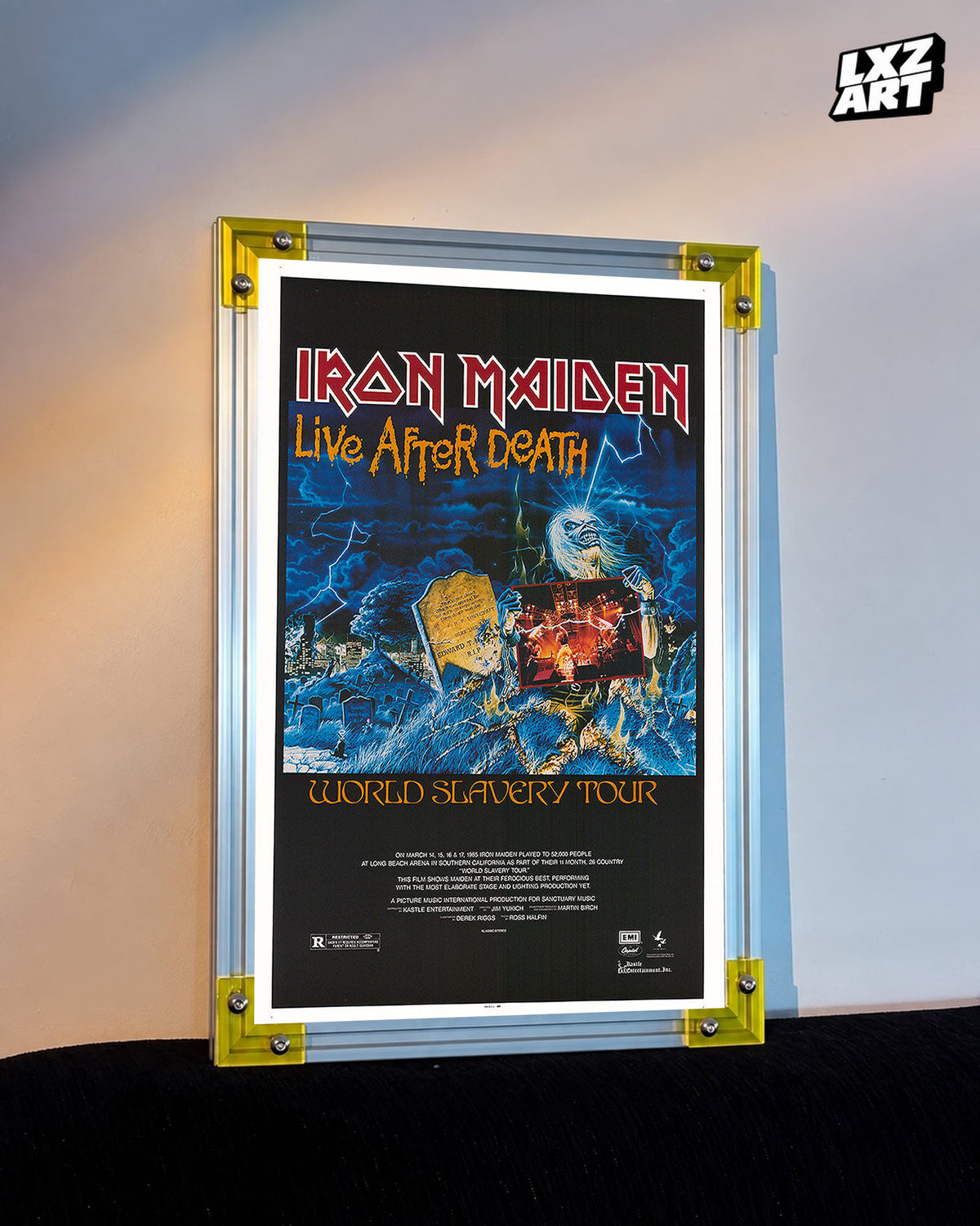 Iron Maiden Live After Death World Slavery Tour poster displayed against a warm wall in a yellow-corner frame; unframed print, frame not included