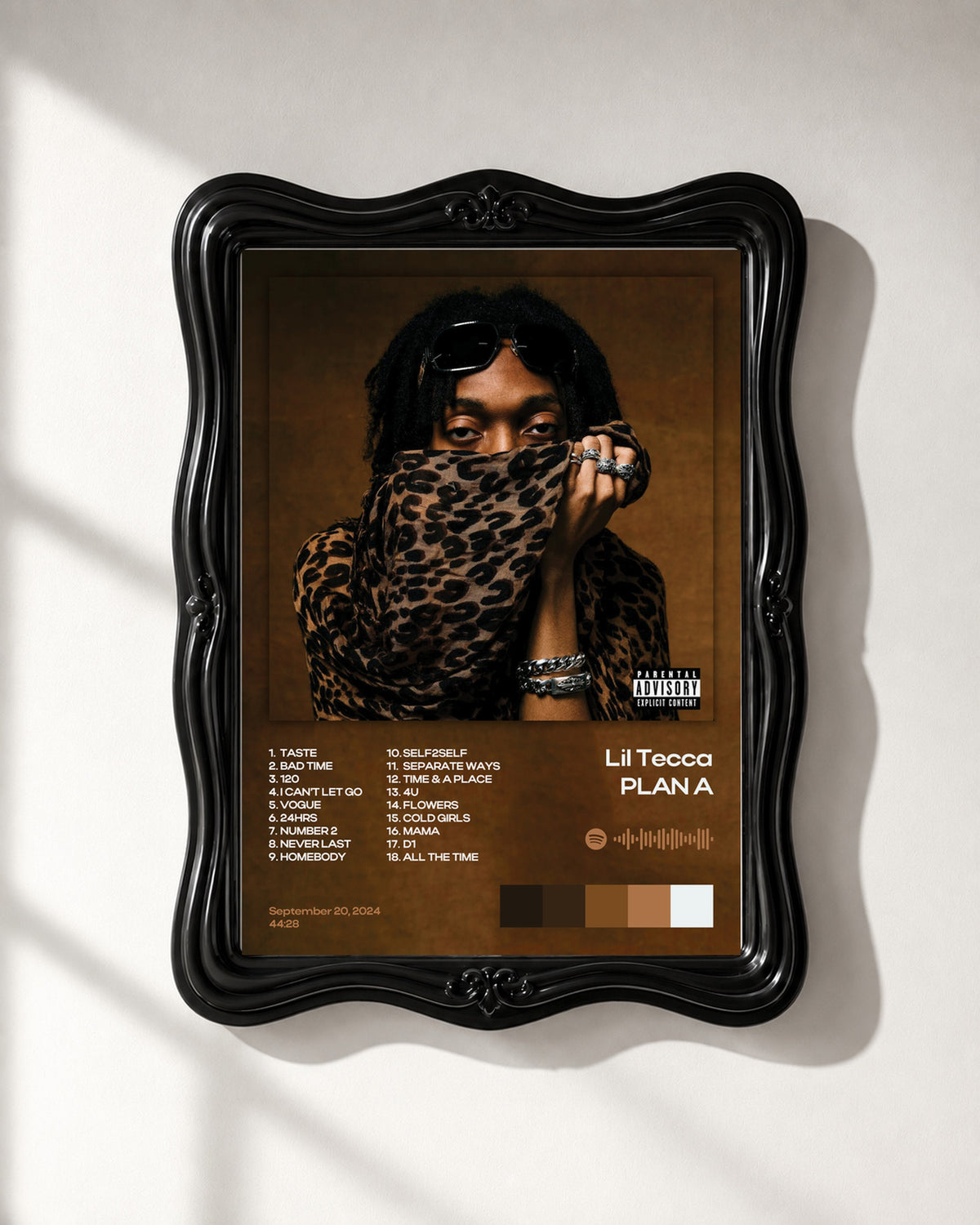 Lil Tecca PLAN A Brown and Gold Tracklist Poster; frame close-up; black ornate frame for display only. Print sold unframed.