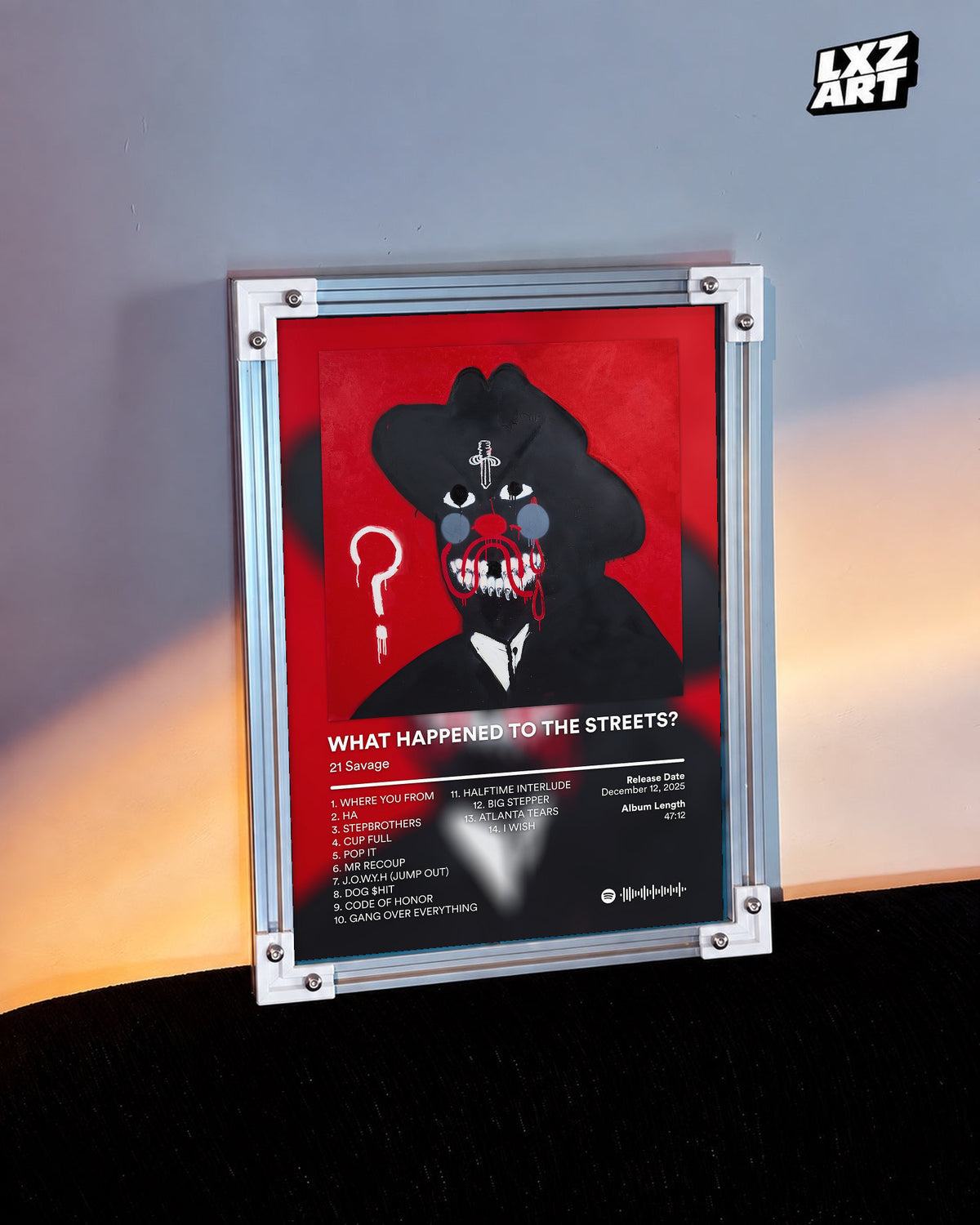 21 Savage What Happened to the Streets? Red Tracklist Poster | Unframed Wall Art shown beside a wall in warm light; frame not included.