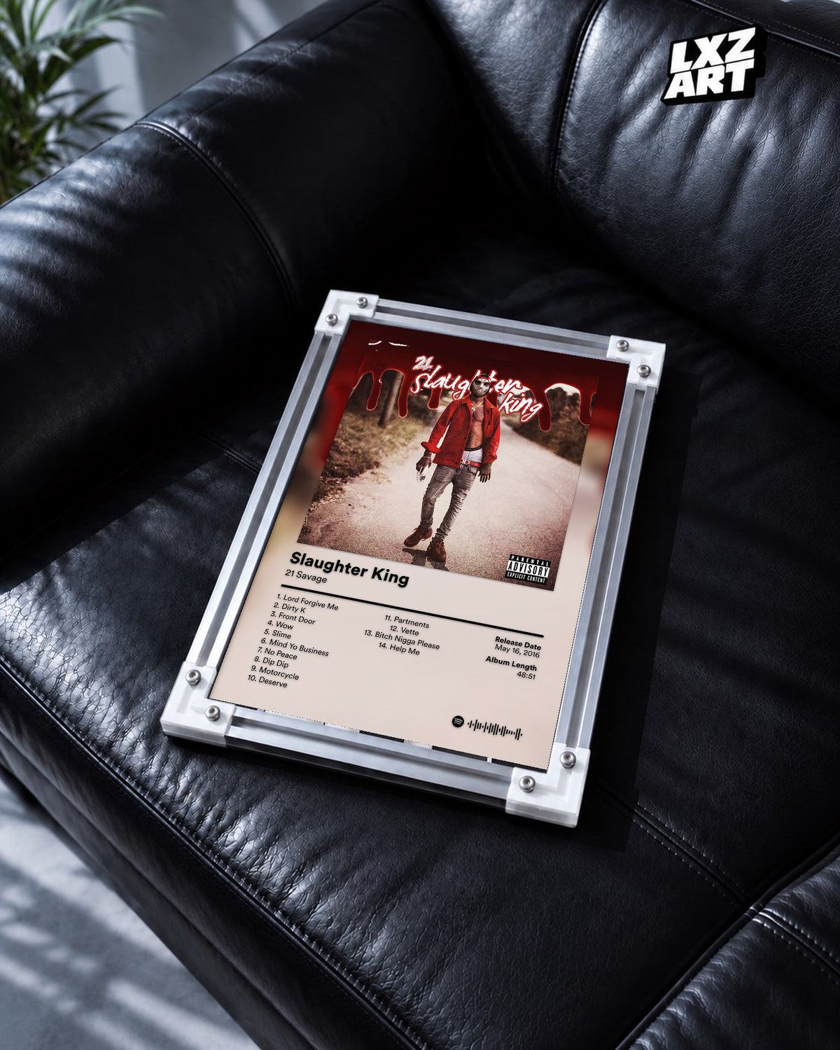 21 Savage Slaughter King Tracklist Poster | Unframed Wall Art displayed on a black leather sofa; frame not included.