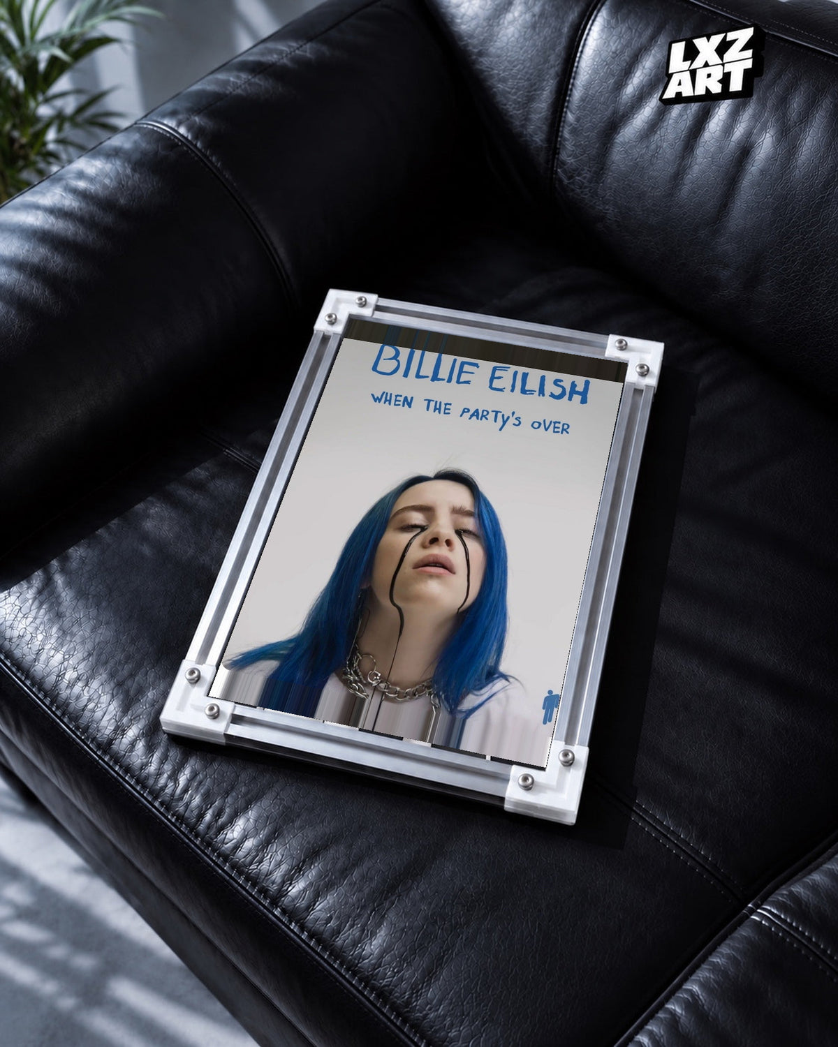 Billie Eilish When The Party’s Over Poster in white-corner frame on black leather sofa. Frame shown for display only.
