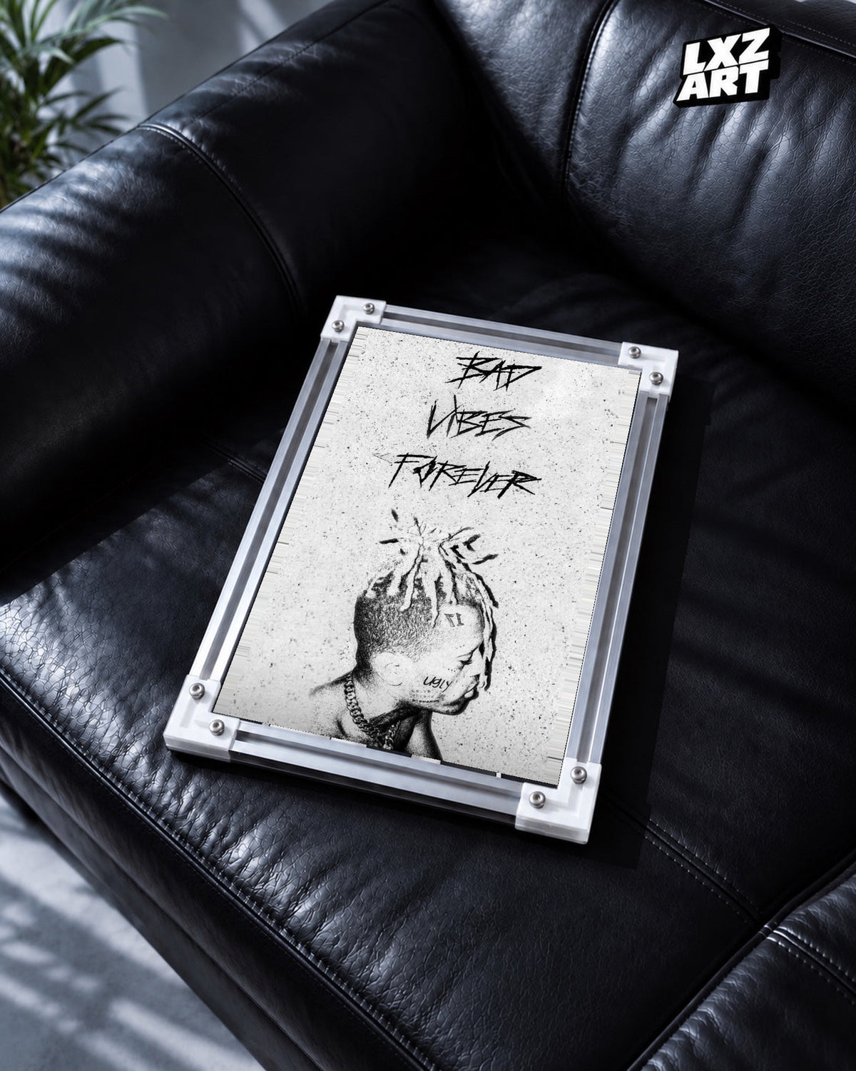 XXXTentacion Bad Vibes Forever Portrait Poster in white-corner frame on black leather sofa. Frame shown for display only.