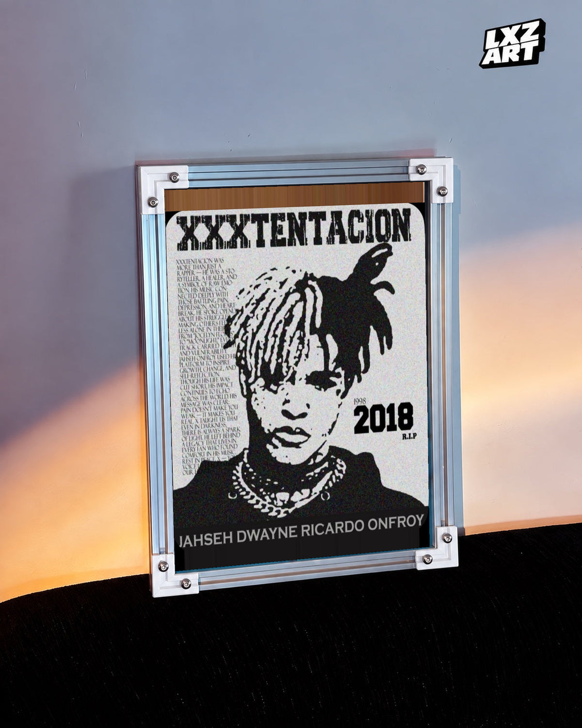 XXXTentacion 1998–2018 Memorial Portrait Poster in white-corner frame beside warm-lit wall. Frame shown for display only.