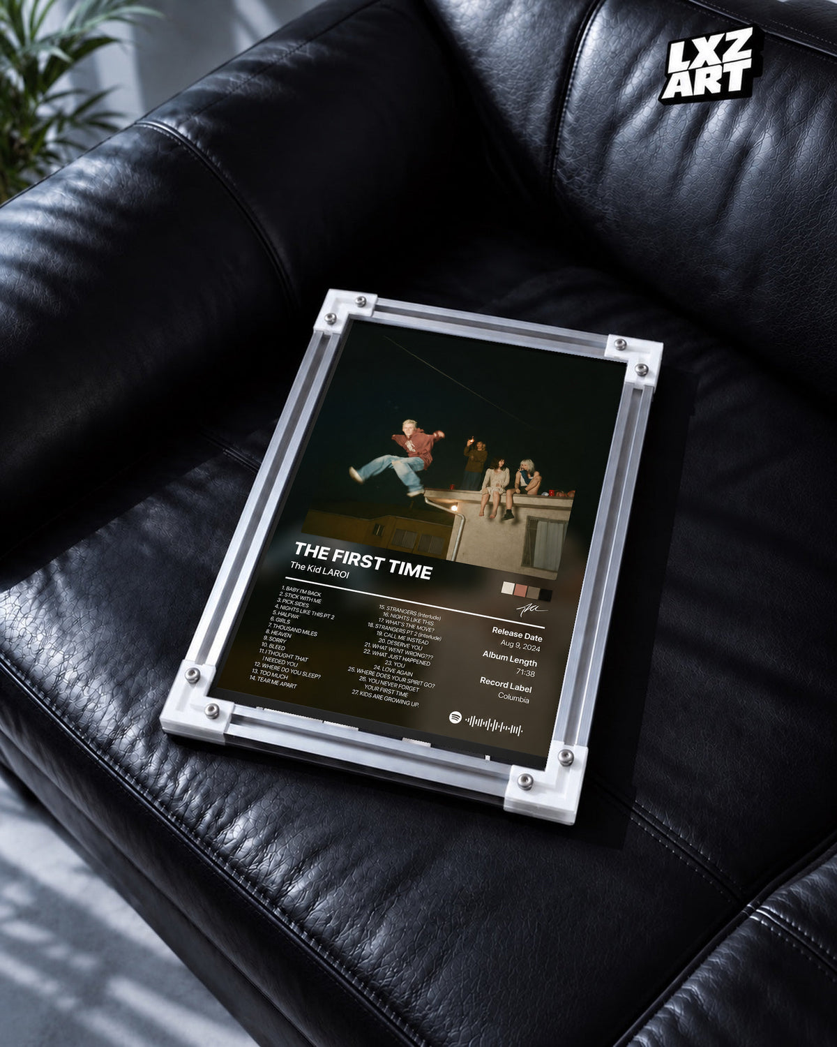 The Kid LAROI The First Time Rooftop Tracklist Poster in white-corner frame on black leather sofa. Frame shown for display only.