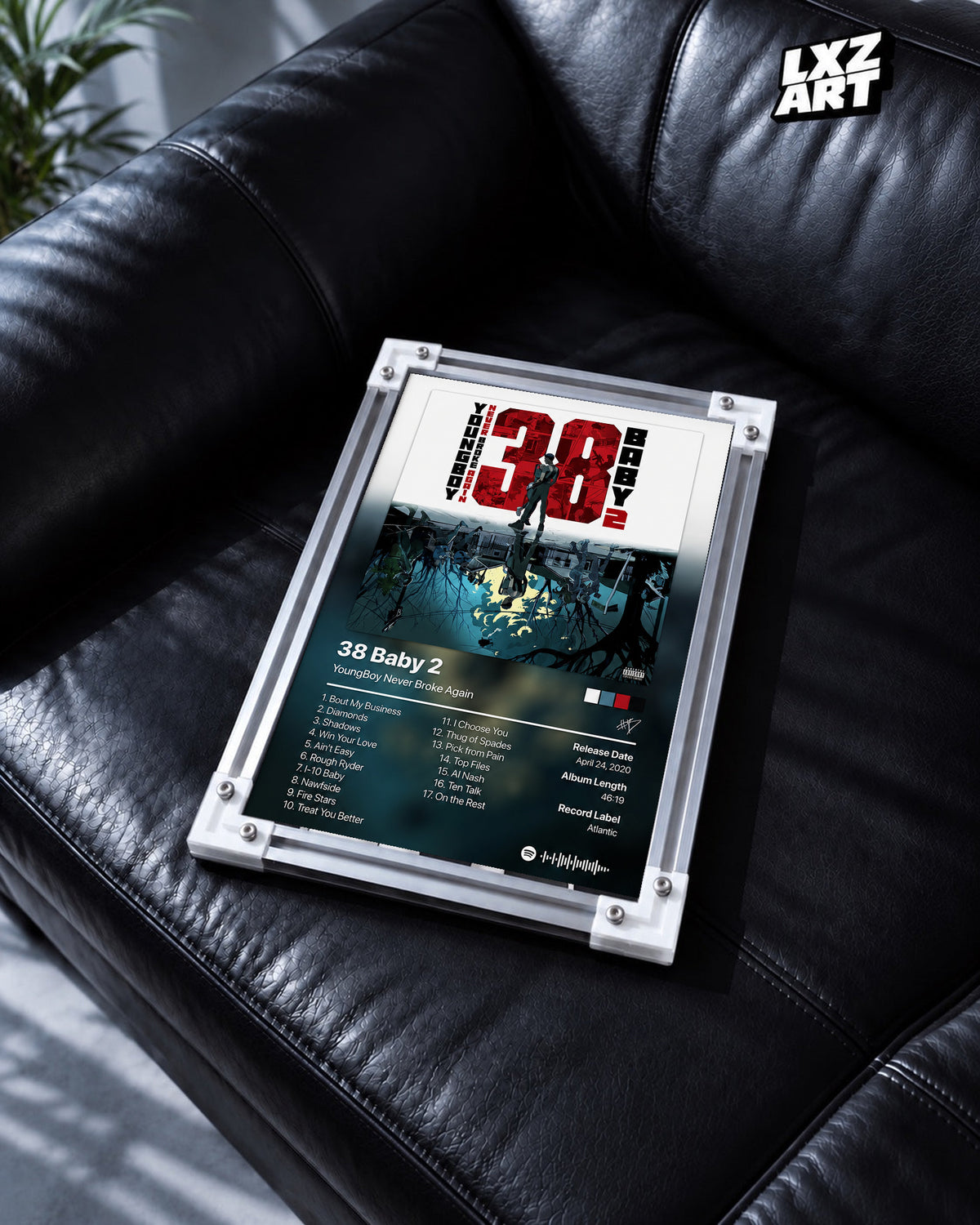 YoungBoy Never Broke Again 38 Baby 2 Tracklist Poster in white-corner frame on black leather sofa. Frame shown for display only.