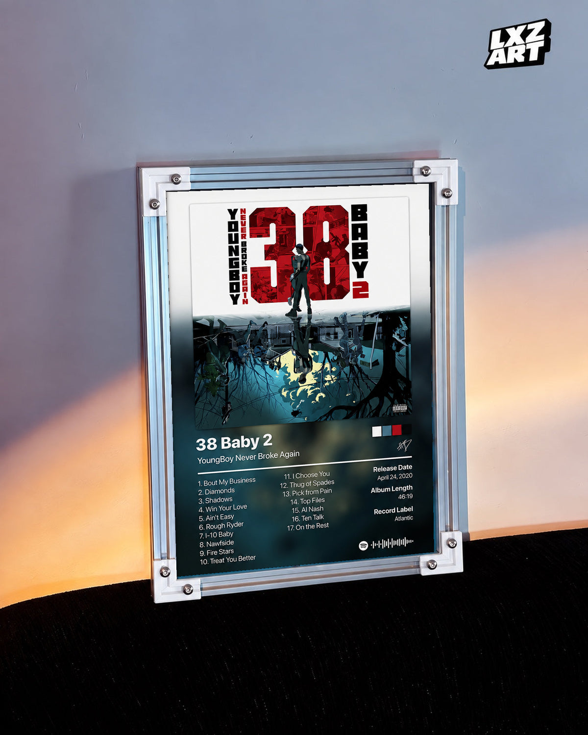 YoungBoy Never Broke Again 38 Baby 2 Tracklist Poster in white-corner frame on warm-lit wall. Frame shown for display only.