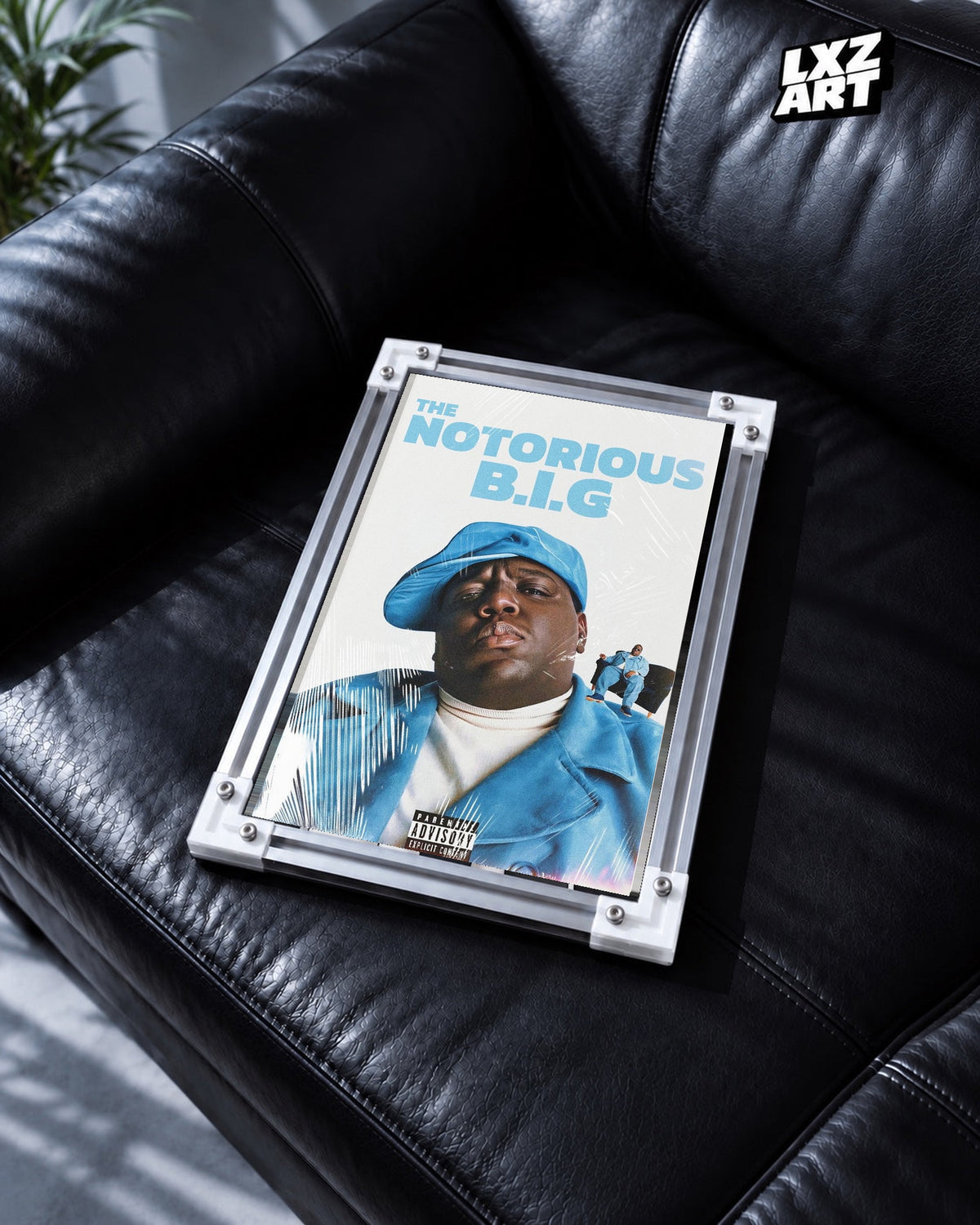 The Notorious B.I.G. Blue Portrait Collage Poster in white-corner frame on black leather sofa. Frame shown for display only.