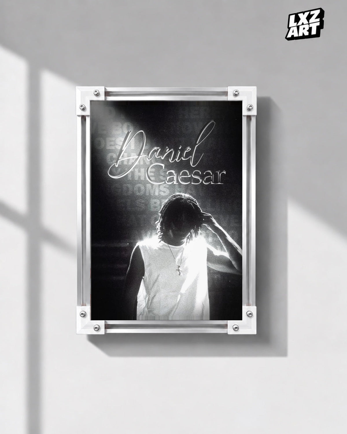 Daniel Caesar Black & White Backlit Portrait Poster in white-corner frame on gray wall. Frame shown for display only.
