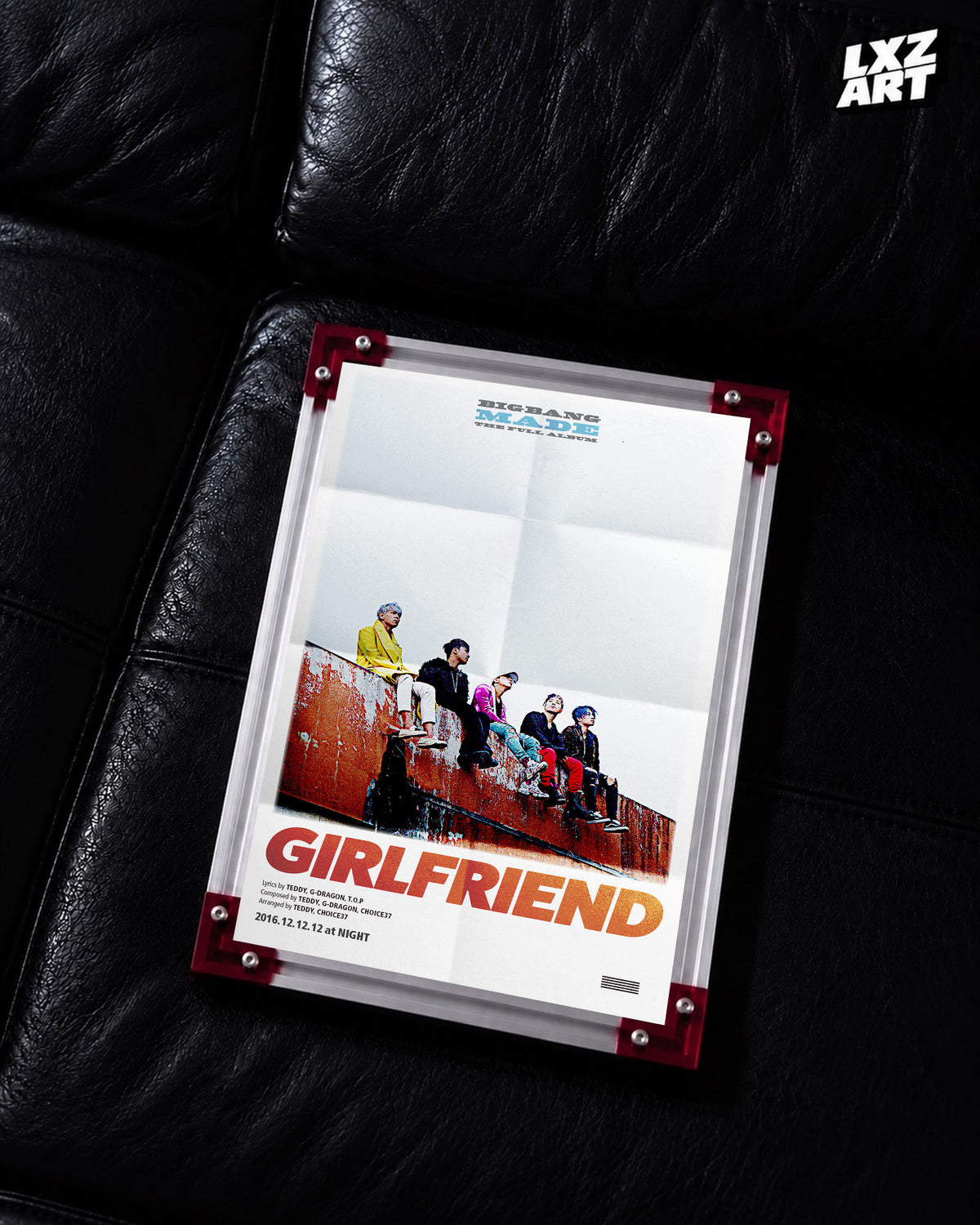 BIGBANG MADE Girlfriend Group Song Poster displayed on a black leather sofa in a red-corner frame; unframed print, frame not included