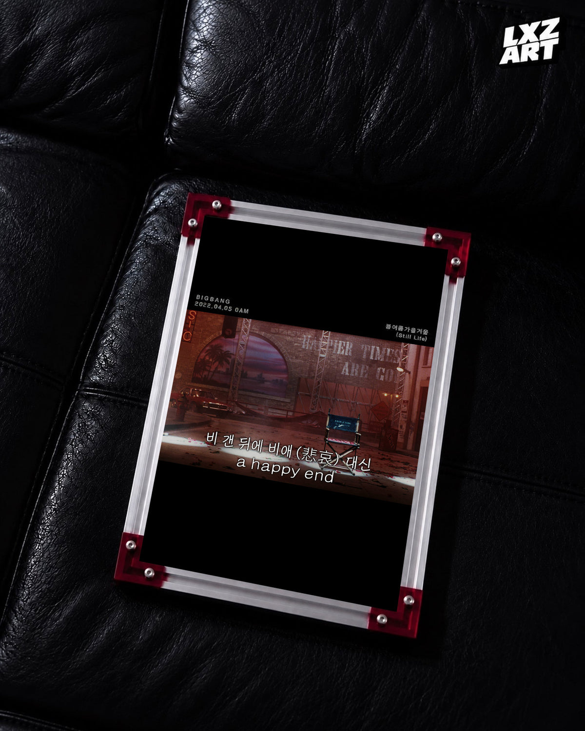 BIGBANG Still Life Red Stage Lyric Poster displayed on a black leather sofa in a red-corner frame; unframed print, frame not included