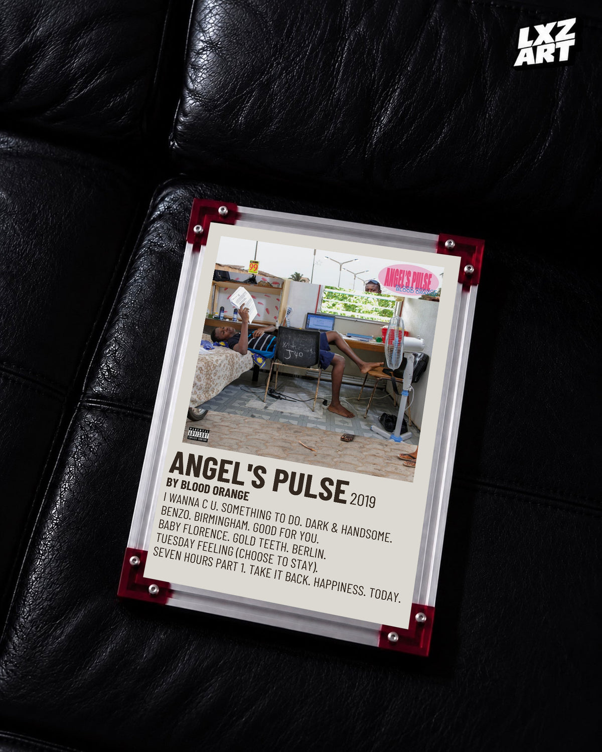 Blood Orange Angel's Pulse cream condensed tracklist poster displayed on a black leather sofa in the red-corner frame; unframed print, frame not included