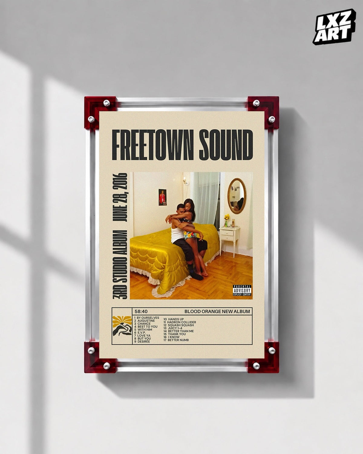 Blood Orange Freetown Sound bold title tracklist poster displayed on a gray wall in the red-corner frame; unframed print, frame not included