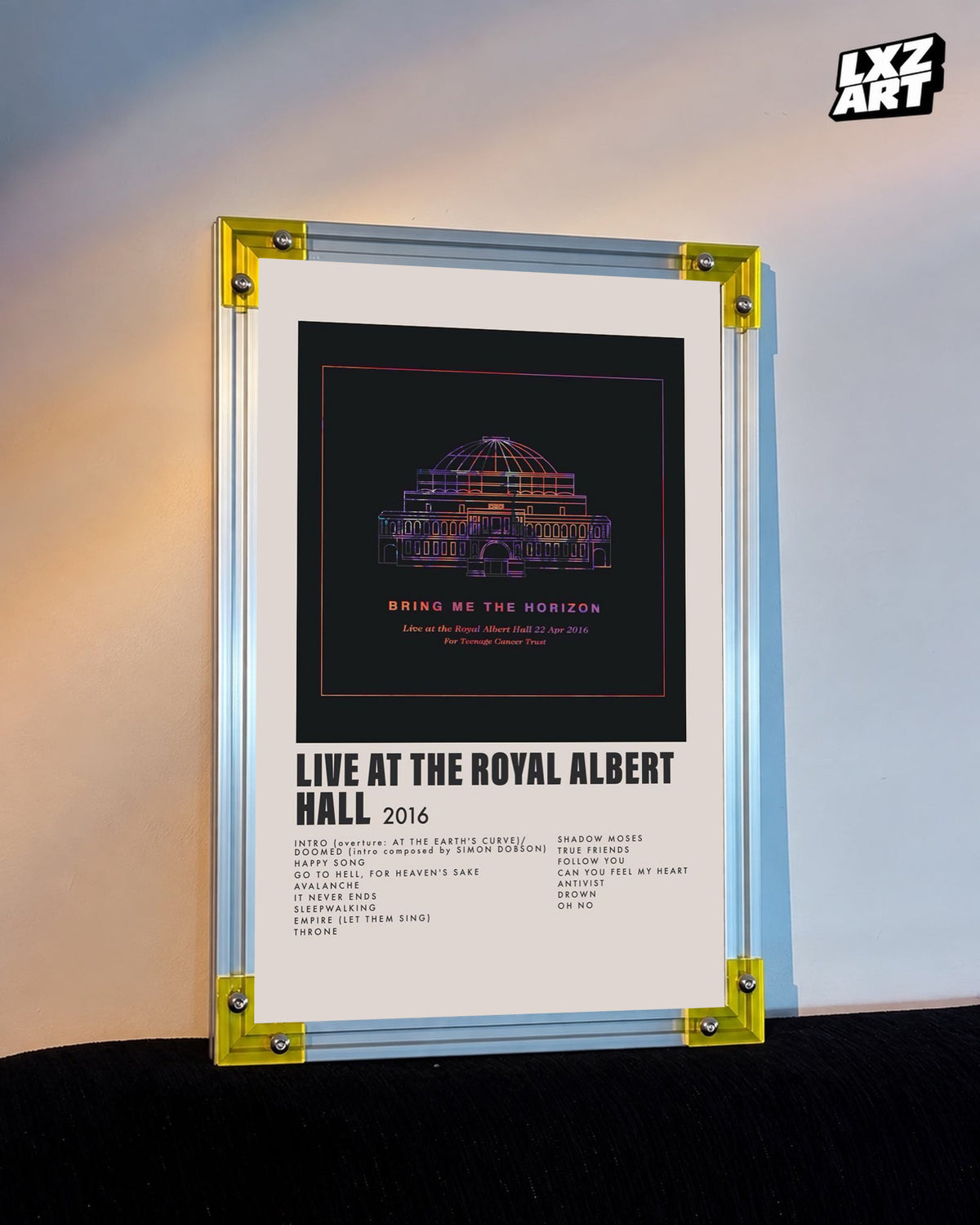 Bring Me The Horizon Live at the Royal Albert Hall concert tracklist poster displayed against a warm wall in a yellow-corner frame; unframed print, frame not included