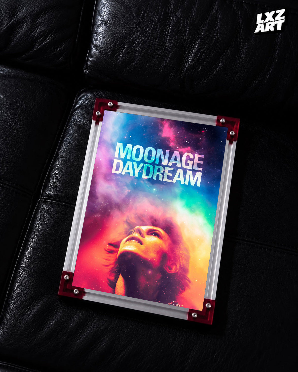 David Bowie Moonage Daydream Cosmic Portrait poster displayed on black leather sofa with red frame corners; frame not included