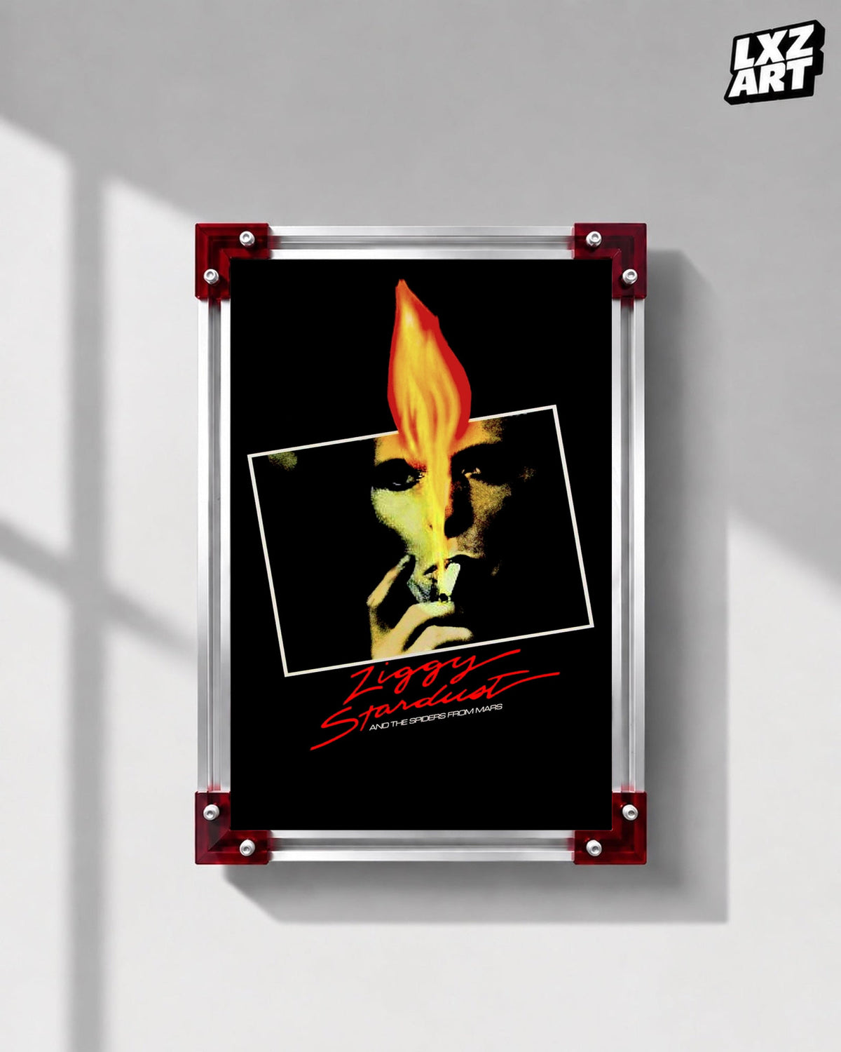 David Bowie Ziggy Stardust Flame Portrait poster displayed on gray wall with red frame corners; frame not included