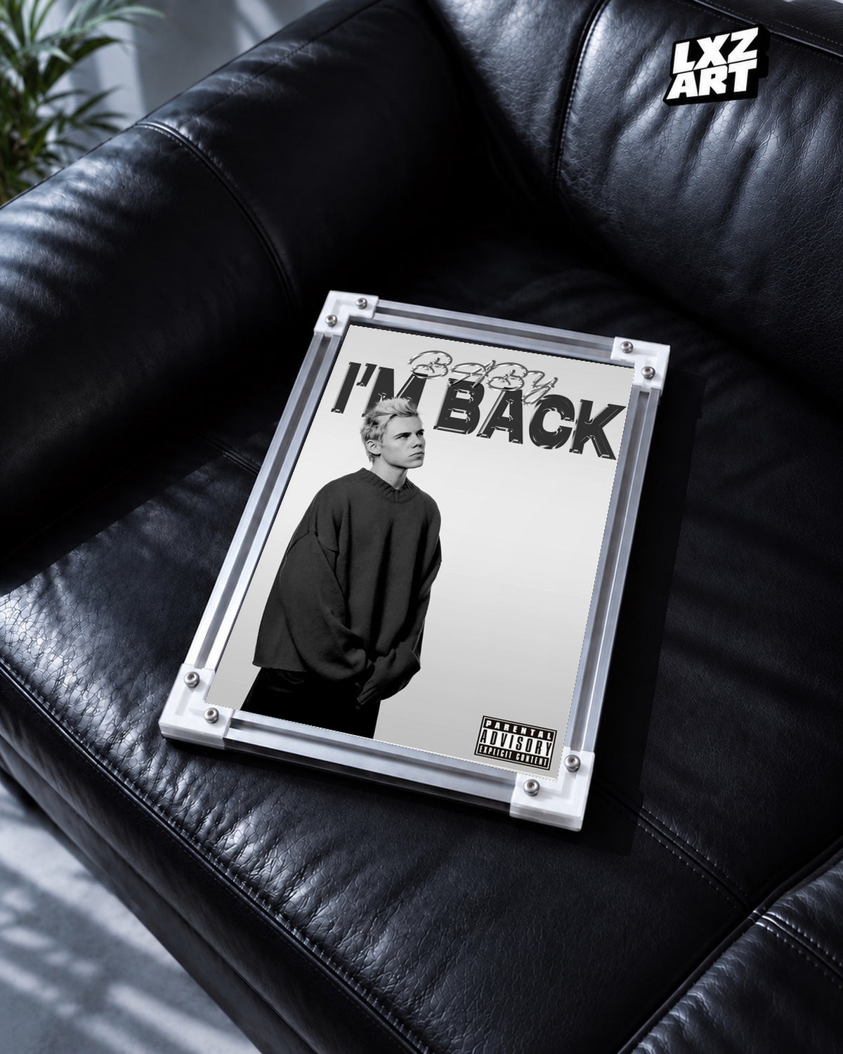 The Kid LAROI BABY I'M BACK Black and White Portrait Poster | Unframed — black leather sofa display; unframed print, frame not included