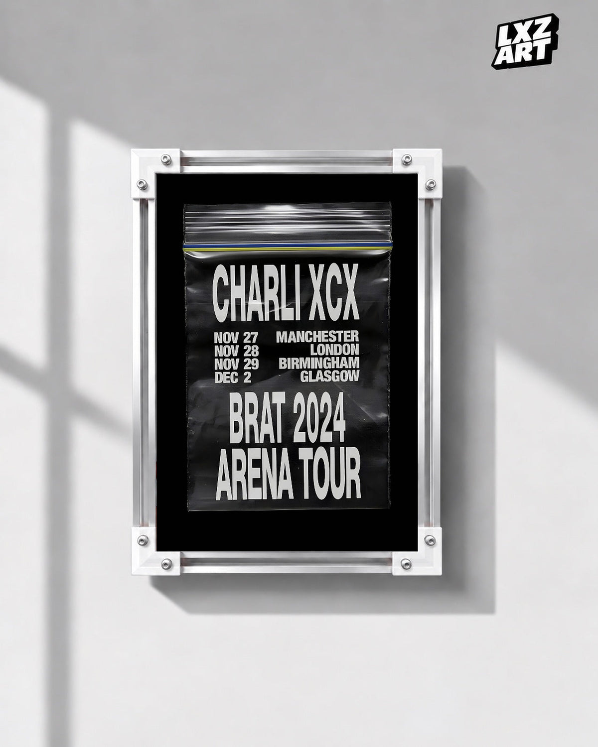 Charli xcx Brat 2024 UK Arena Tour Zip Bag unframed poster shown in the gray-wall frame display.