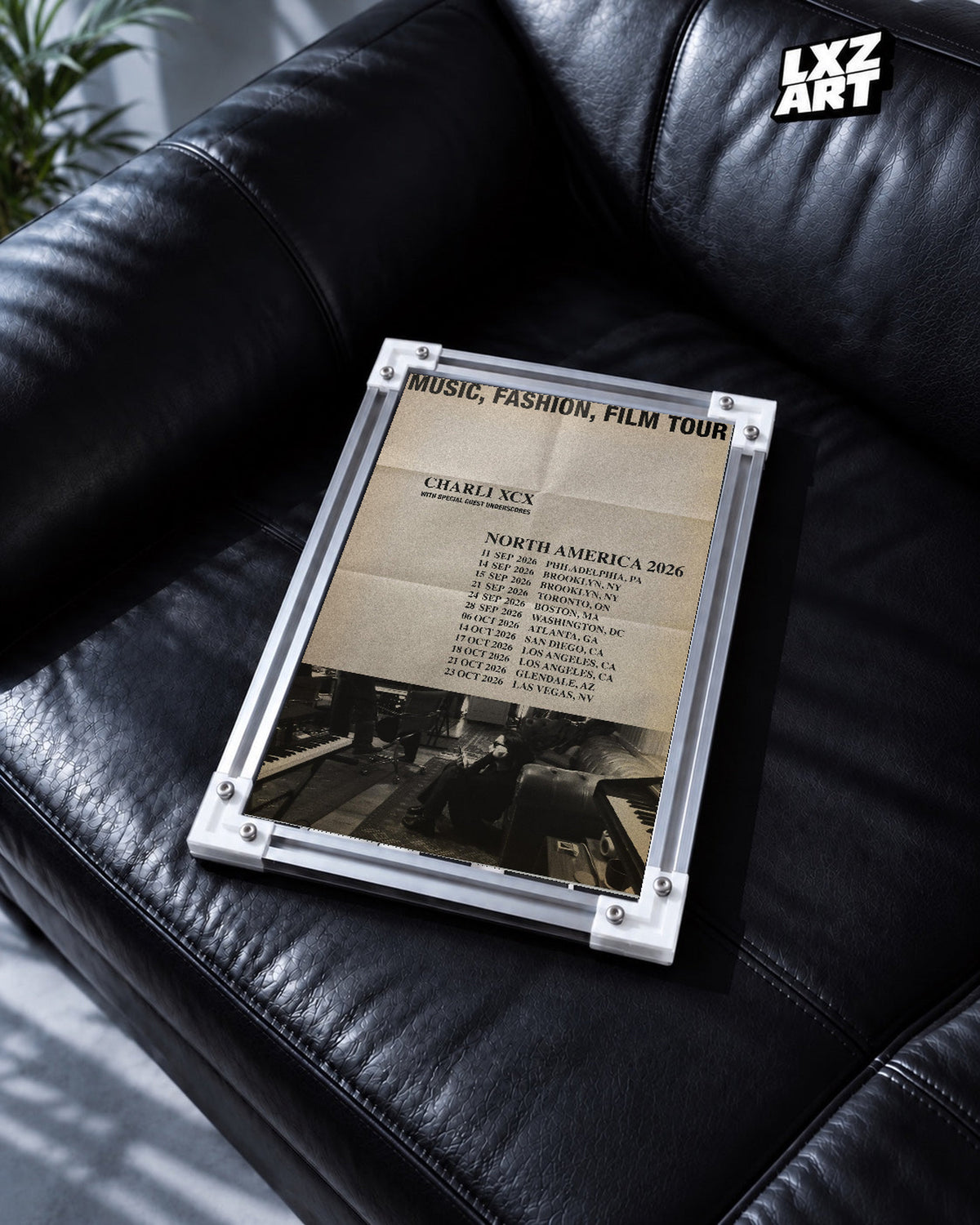 Charli xcx Music Fashion Film 2026 Tour unframed poster shown in the black leather sofa display.