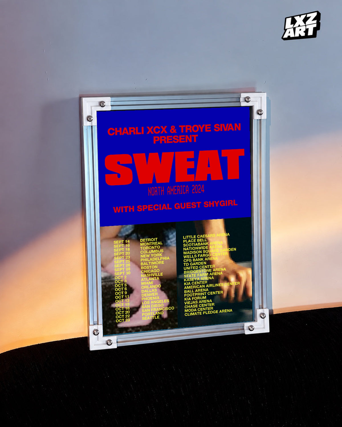 Charli xcx Sweat 2024 Blue and Red Tour unframed poster shown in the warm-lit wall display.