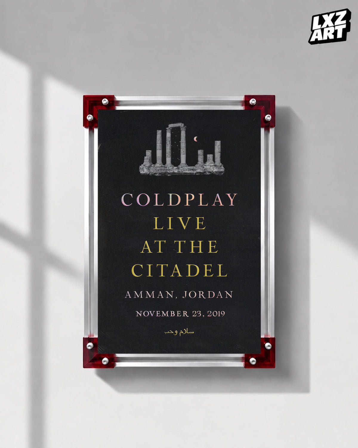 Coldplay Everyday Life Live at the Citadel Poster displayed on a gray wall in a red-corner frame; unframed print, frame not included