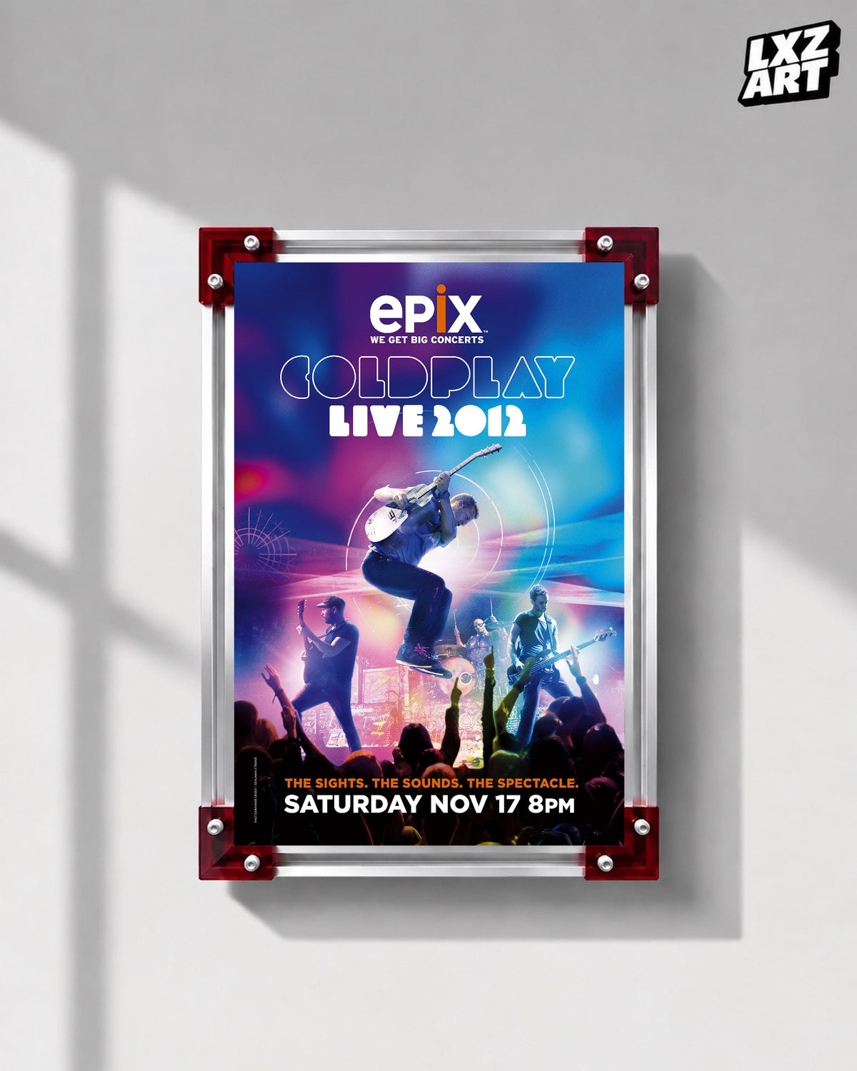 Coldplay Live 2012 Epix TV Special Poster displayed on a gray wall in a red-corner frame; unframed print, frame not included