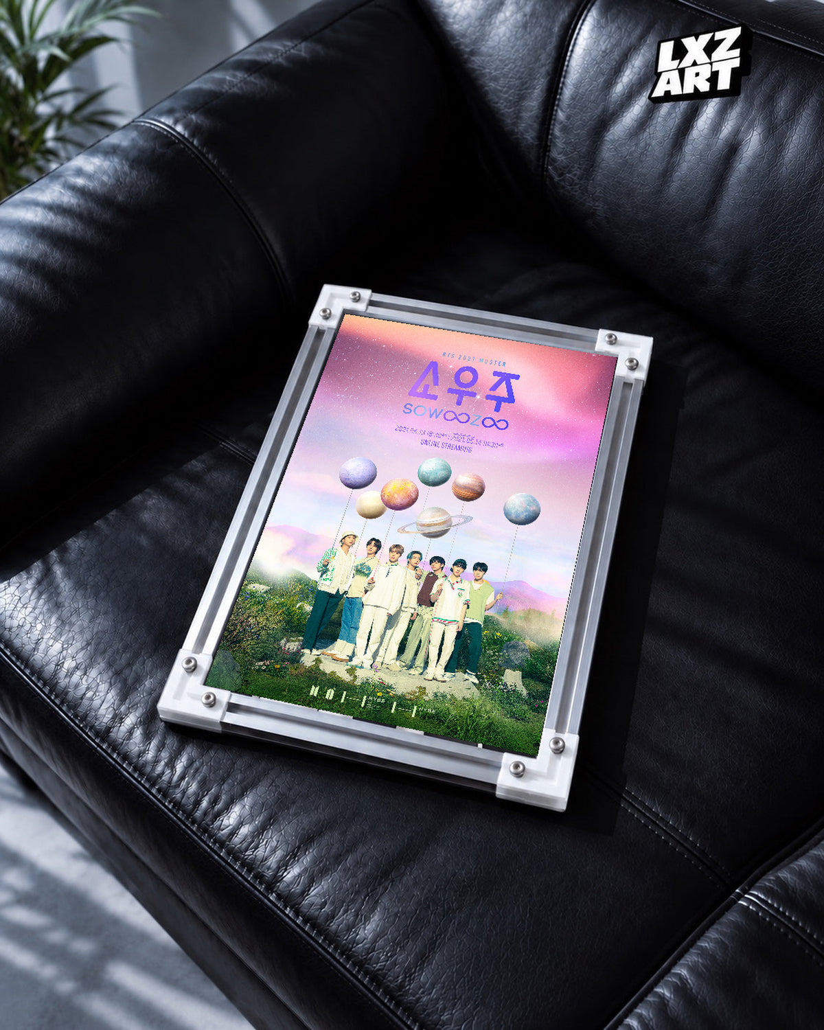 BTS 2021 Muster Sowoozoo poster in the LXZART black leather sofa display. Unframed print; frame shown for display only.