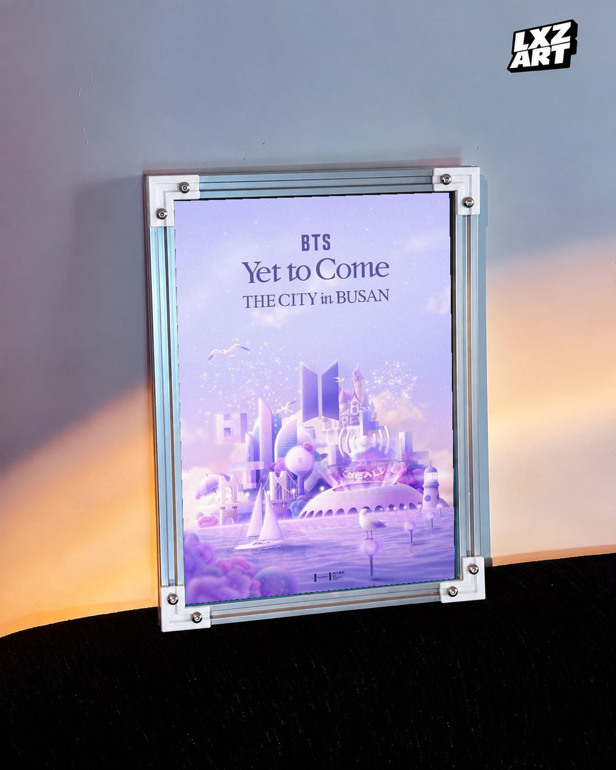 BTS Yet To Come The City in Busan poster in the LXZART warm-lit wall display. Unframed print; frame shown for display only.