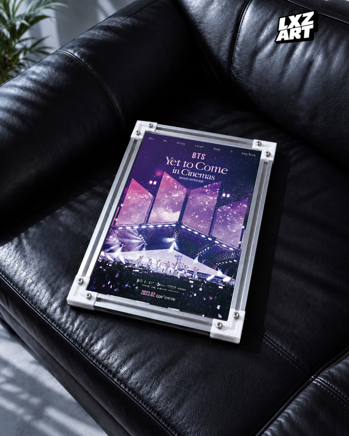 BTS Yet To Come in Cinemas poster in the LXZART black leather sofa display. Unframed print; frame shown for display only.
