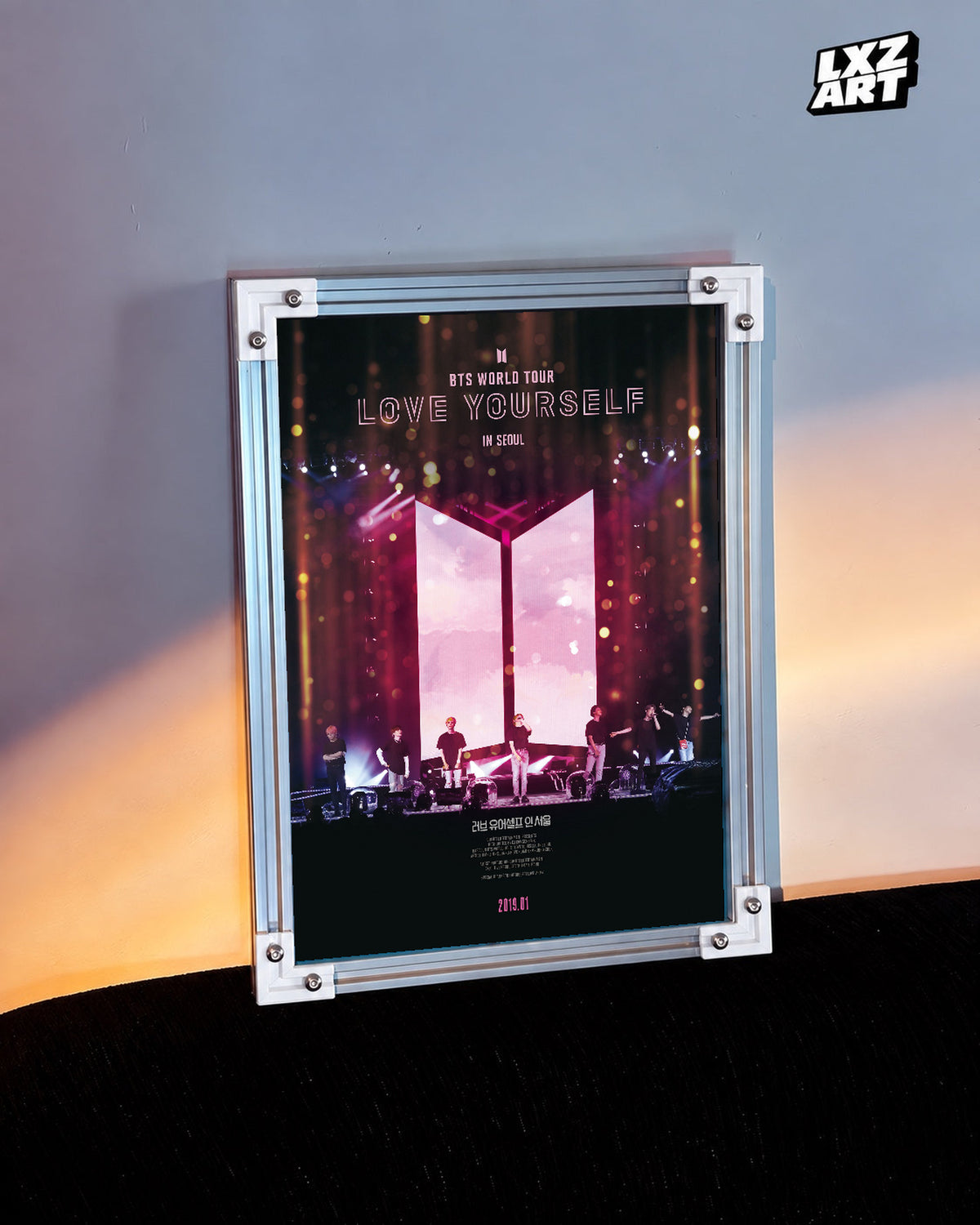 BTS World Tour Love Yourself in Seoul poster in the LXZART warm-lit wall display. Unframed print; frame shown for display only.