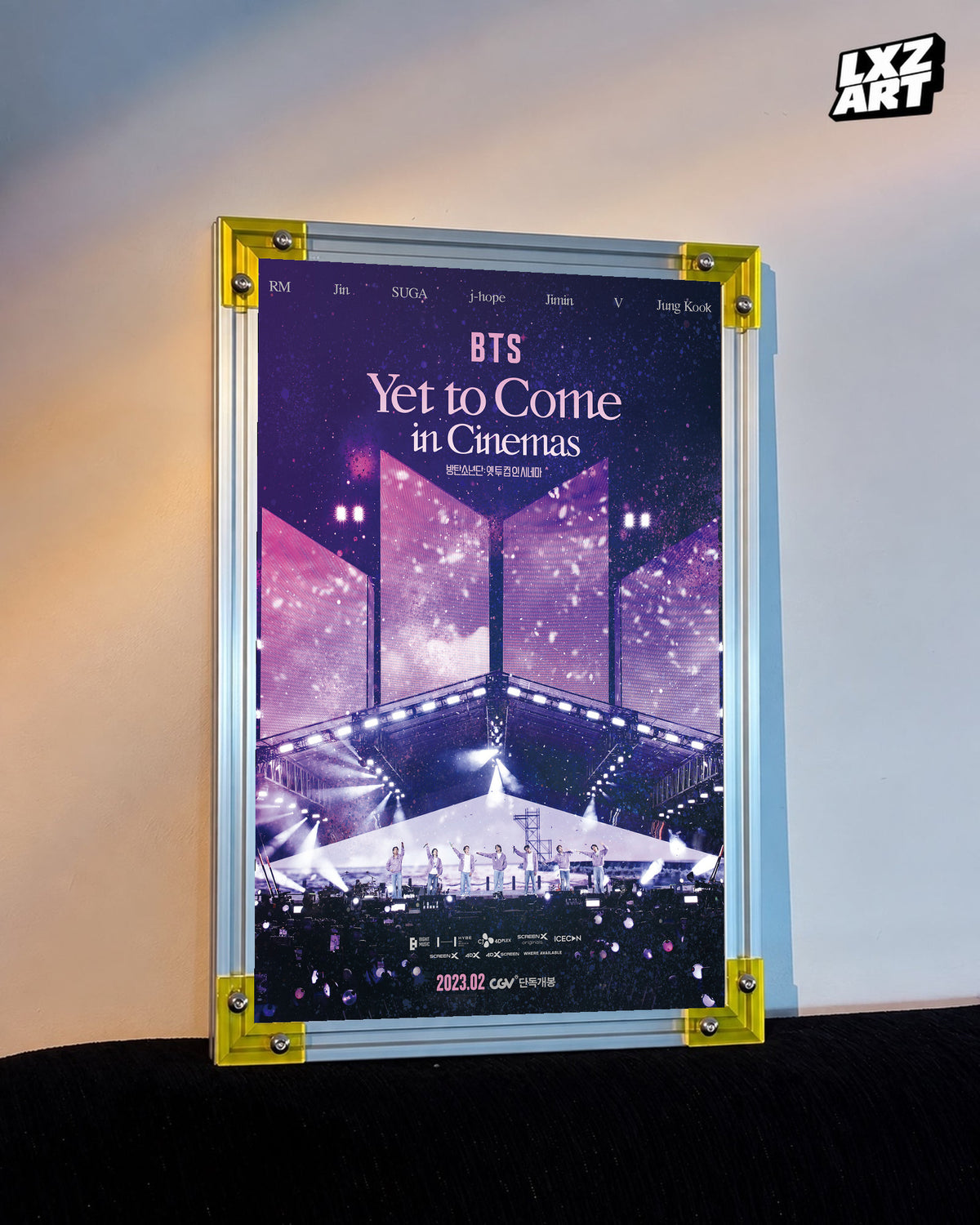 BTS Yet to Come in Cinemas concert film poster displayed against a warm wall in a yellow-corner frame; unframed print, frame not included