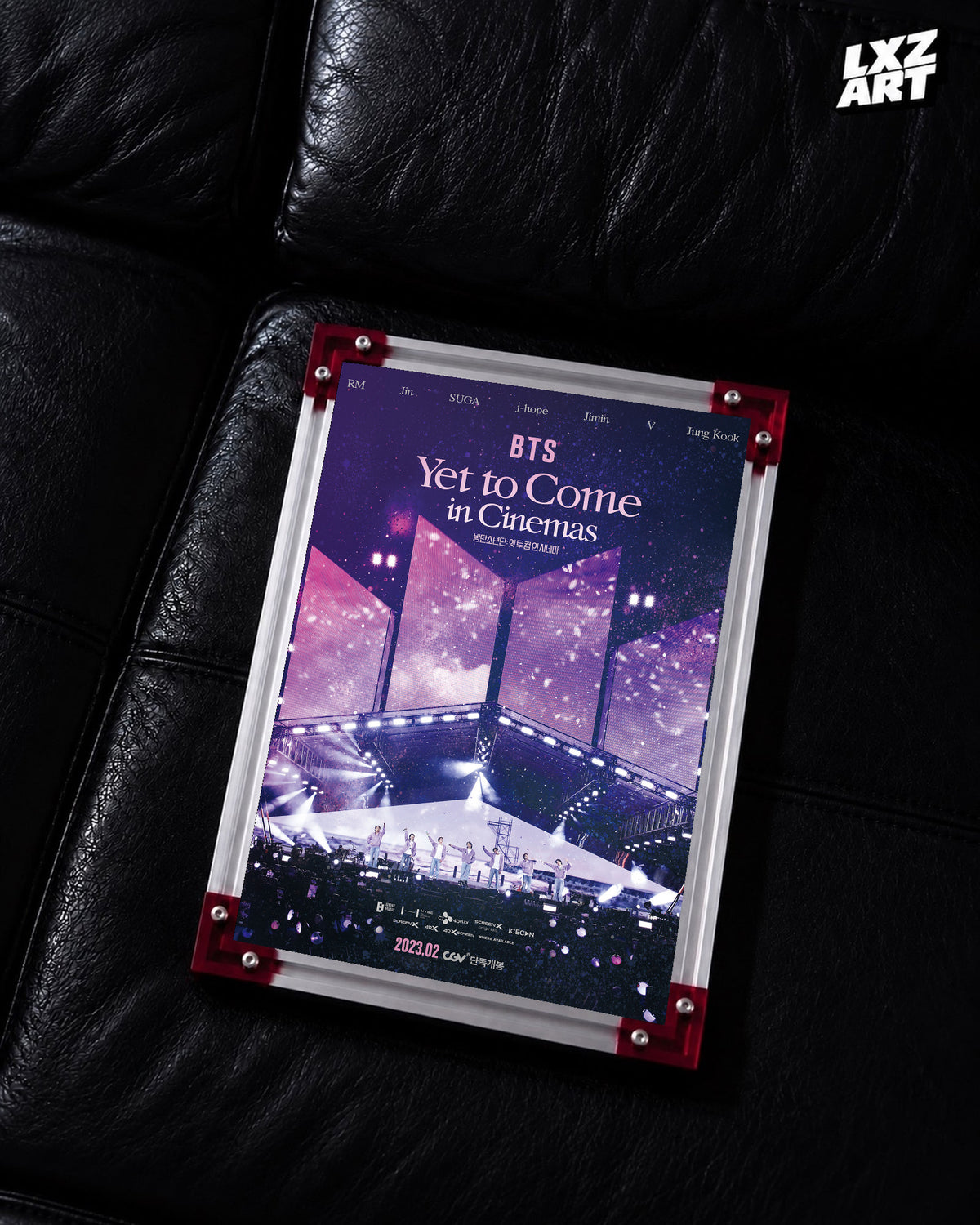 BTS Yet to Come in Cinemas concert film poster displayed on a black leather sofa in a red-corner frame; unframed print, frame not included