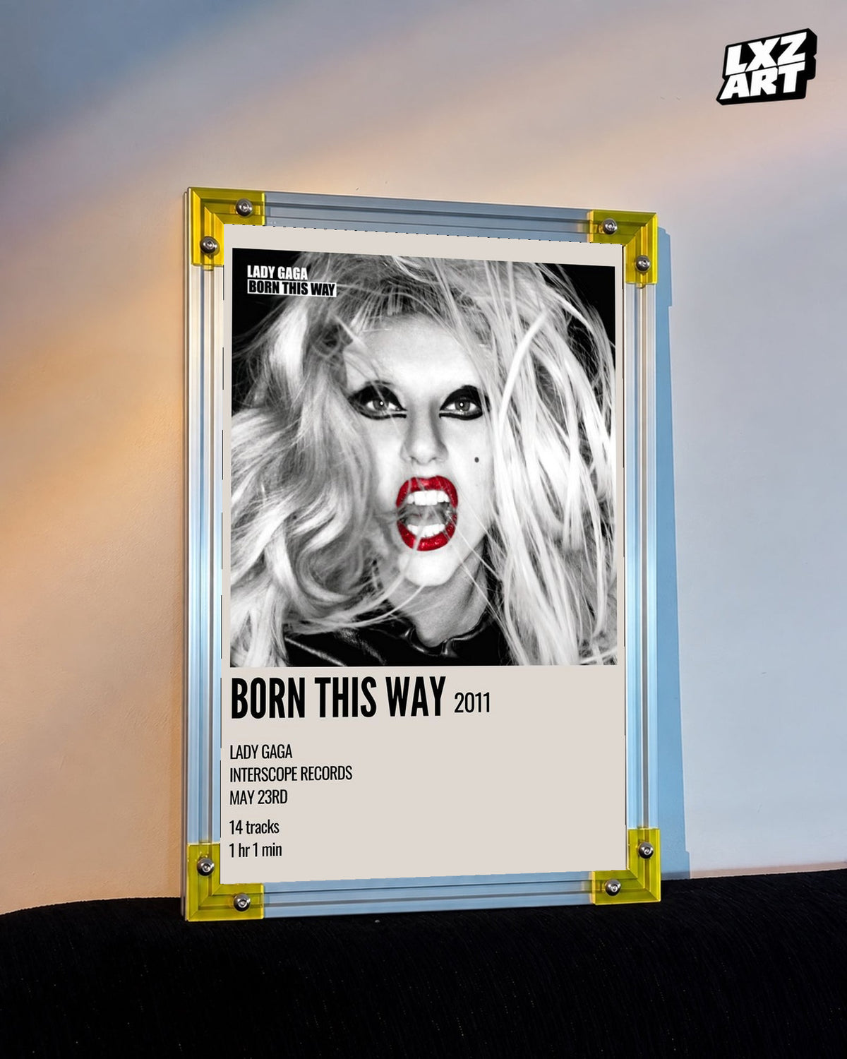Lady Gaga Born This Way album cover poster displayed against a warm wall in a yellow corner frame; unframed print, frame not included