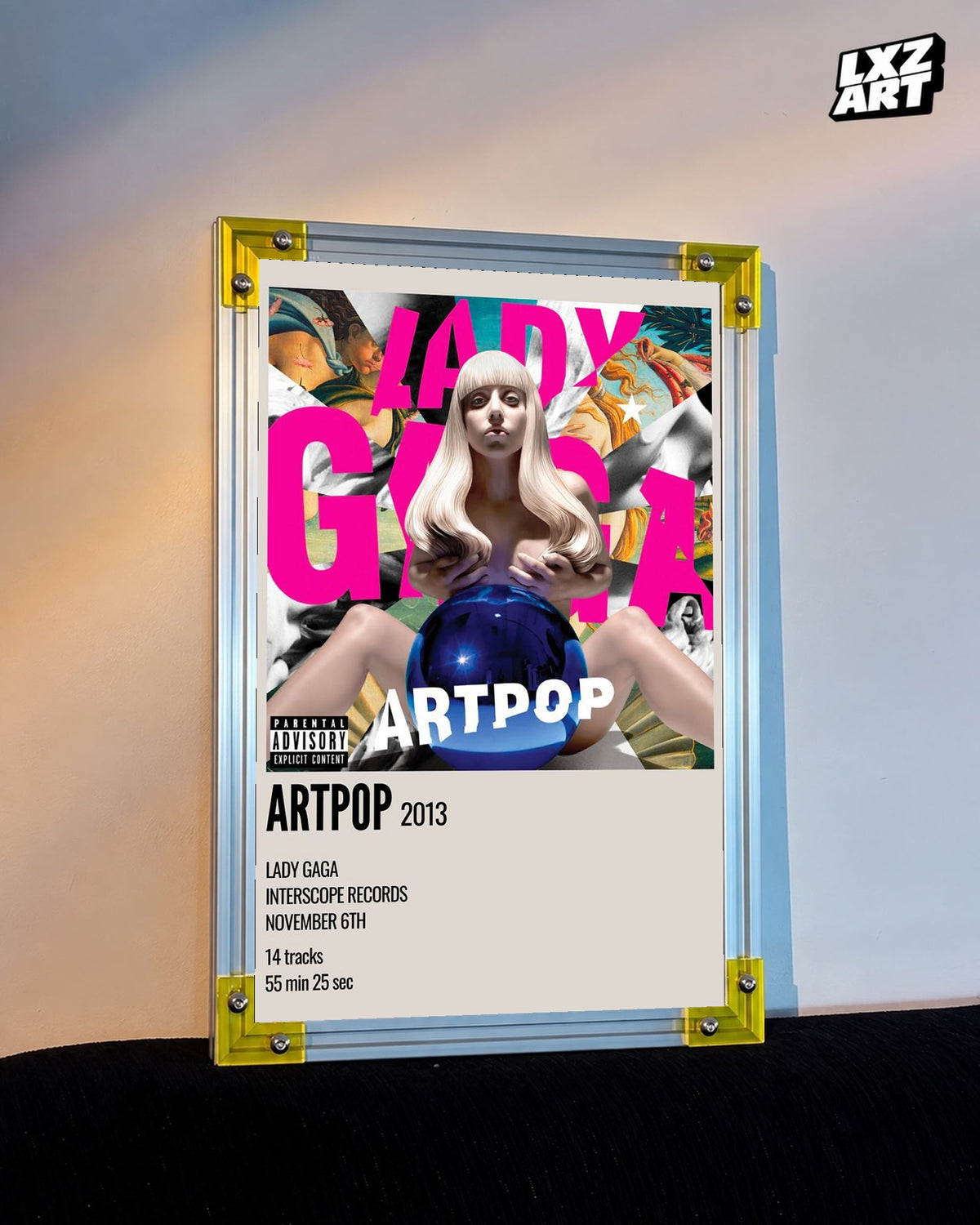 Lady Gaga ARTPOP album cover poster displayed against a warm wall in a yellow corner frame; unframed print, frame not included