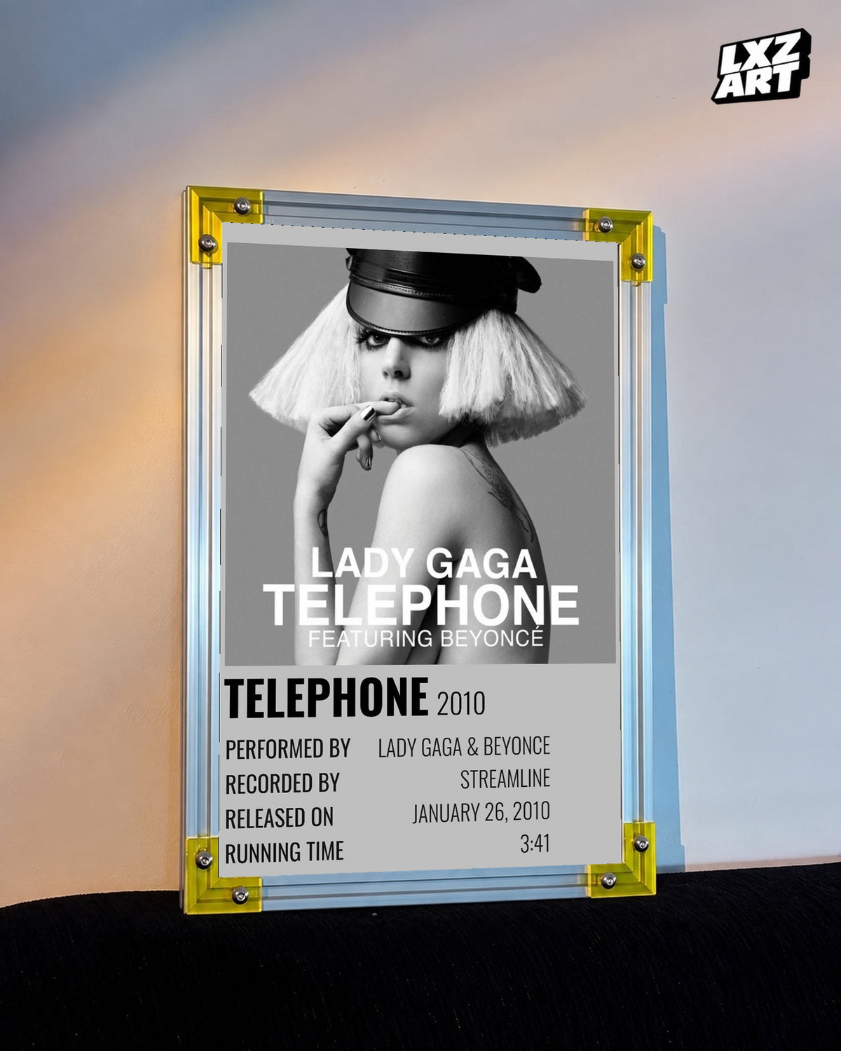 Lady Gaga feat. Beyoncé Telephone single cover poster displayed against a warm wall in a yellow corner frame; unframed print, frame not included