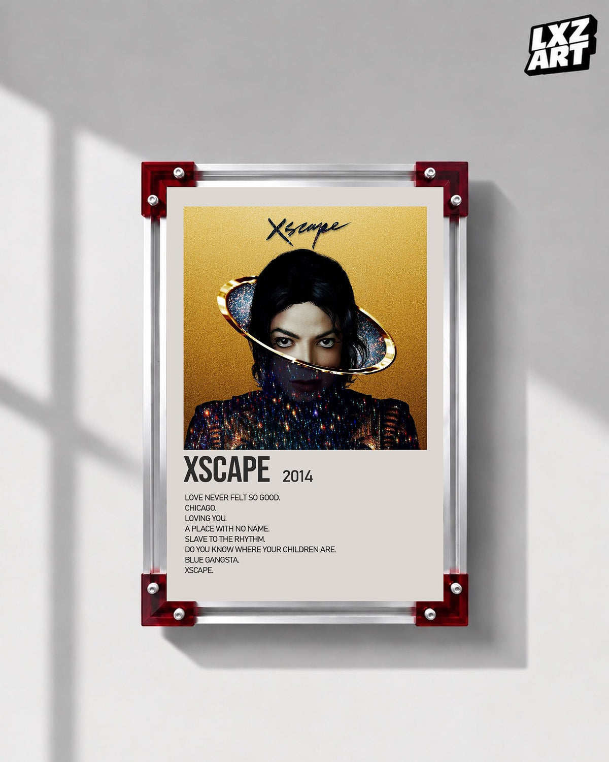 Michael Jackson Xscape Gold tracklist poster displayed on a gray wall in a red corner frame; unframed print, frame not included