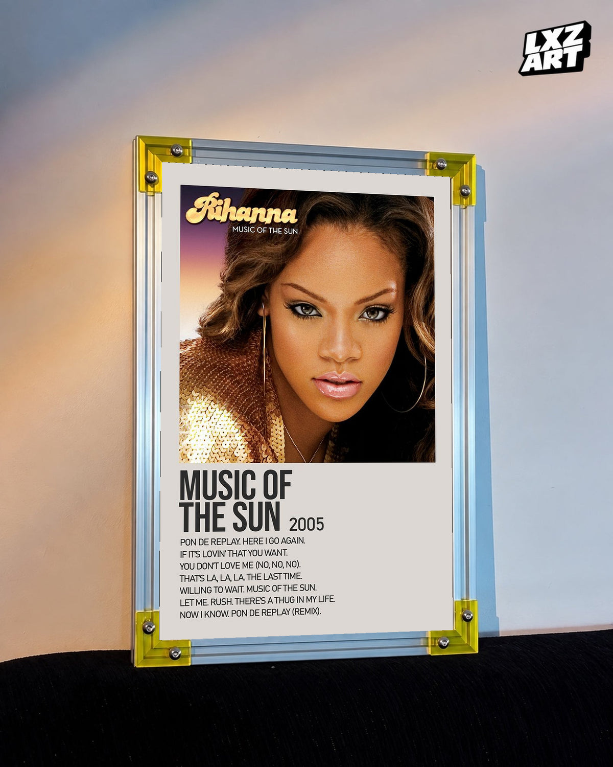 Rihanna Music of the Sun album tracklist poster displayed against a warm wall in a yellow corner frame; unframed print, frame not included