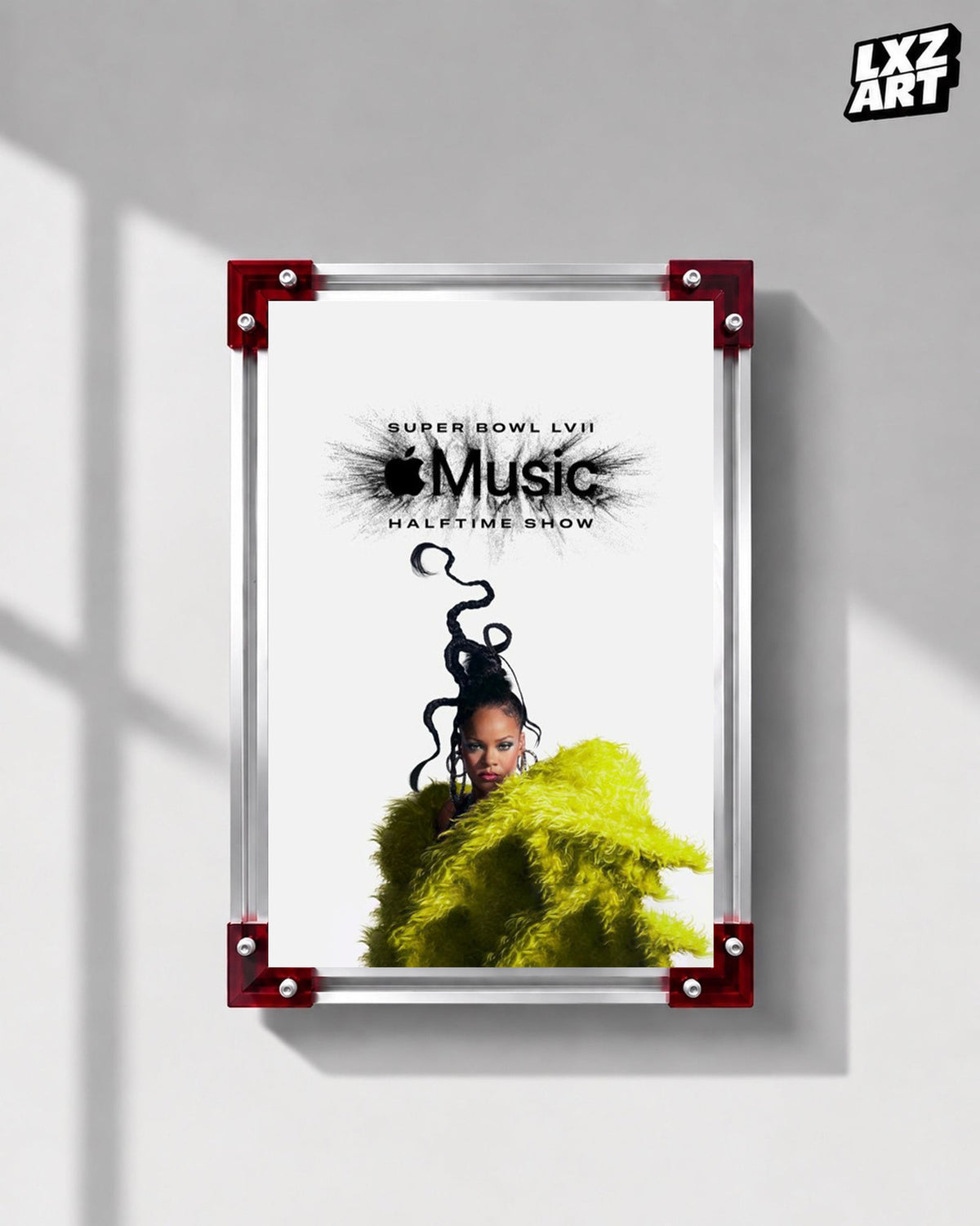 Rihanna Apple Music Super Bowl LVII Halftime Show performance poster displayed on a gray wall in a red corner frame; unframed print, frame not included