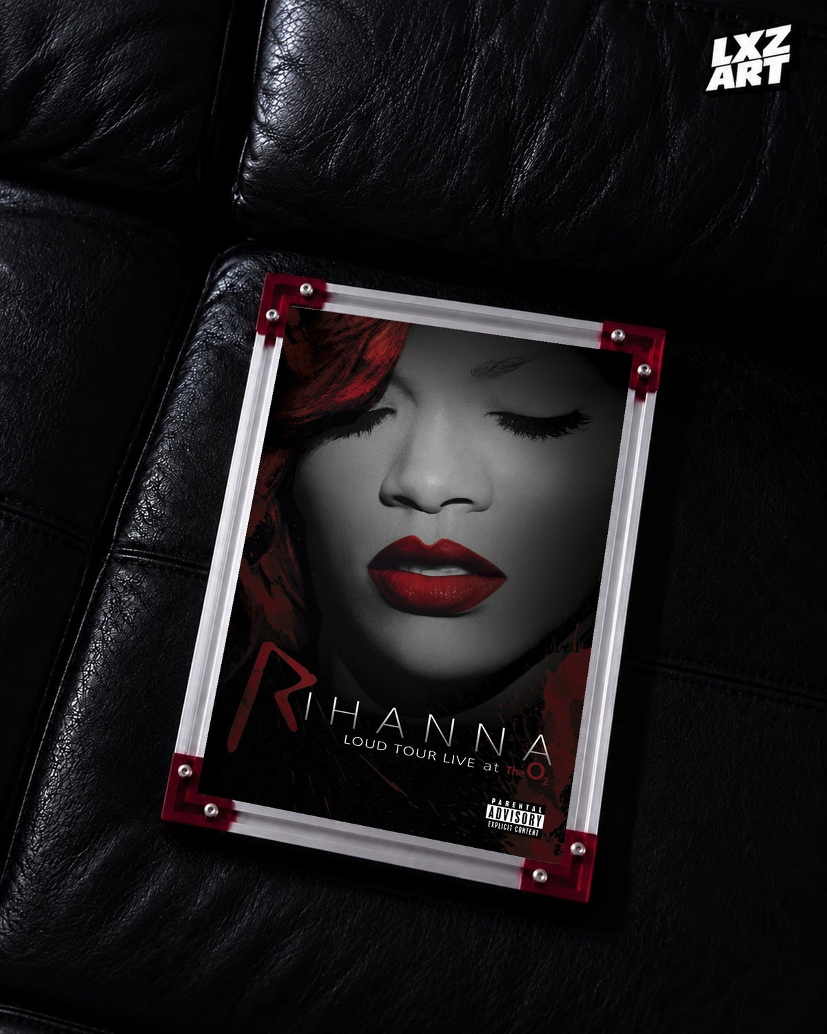 Rihanna Loud Tour Live at the O2 concert film poster displayed on a black leather sofa in a red corner frame; unframed print, frame not included