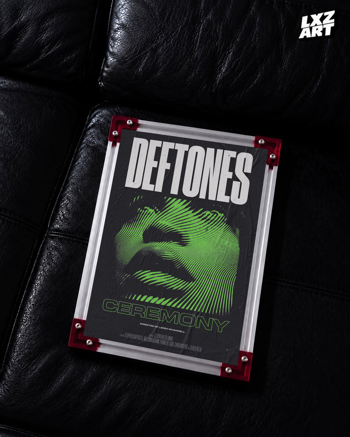 Deftones Ceremony Green Face Music Video Poster displayed on a black leather sofa in a red-corner frame; unframed print, frame not included