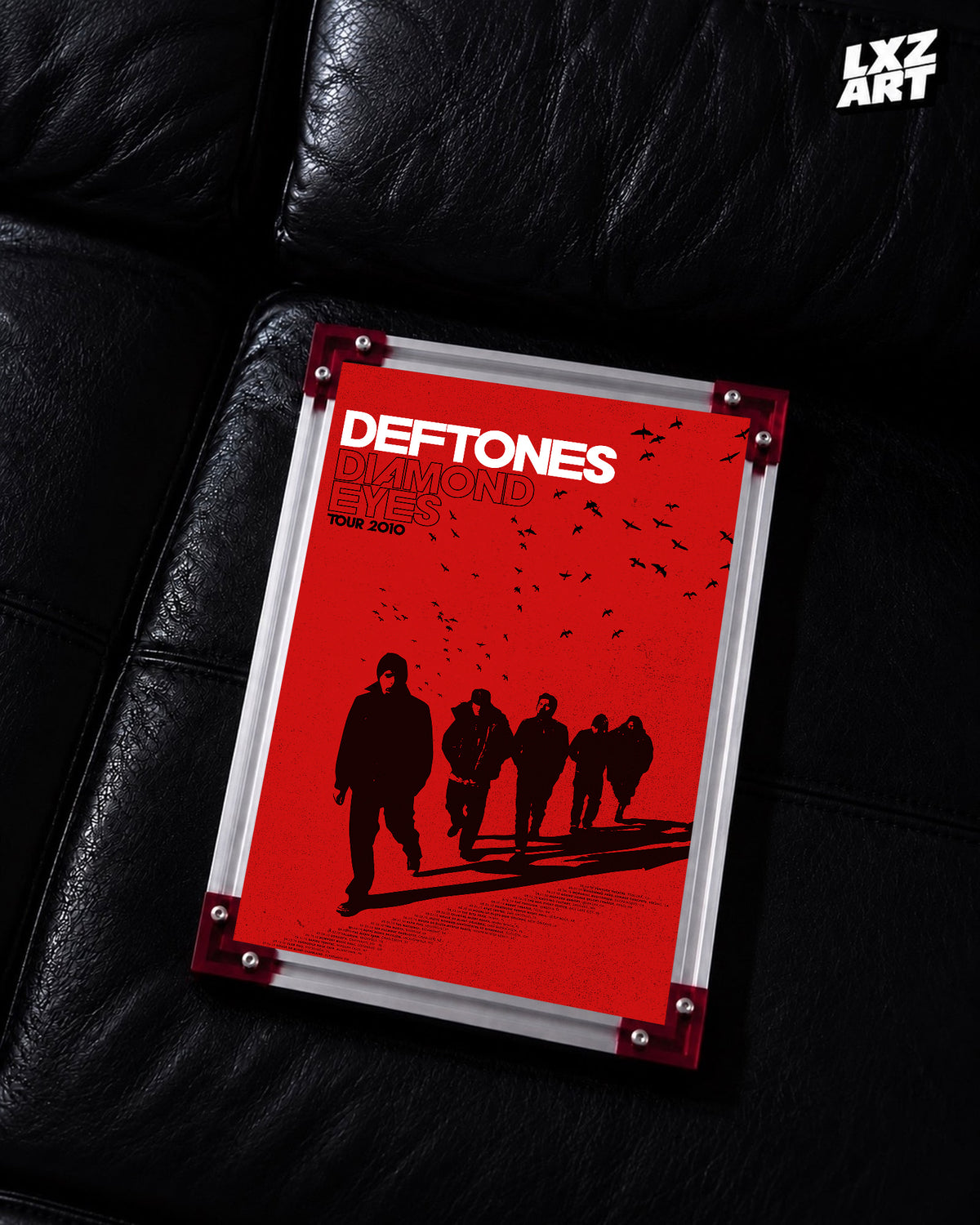 Deftones Diamond Eyes Red Silhouettes 2010 Tour Poster displayed on a black leather sofa in a red-corner frame; unframed print, frame not included