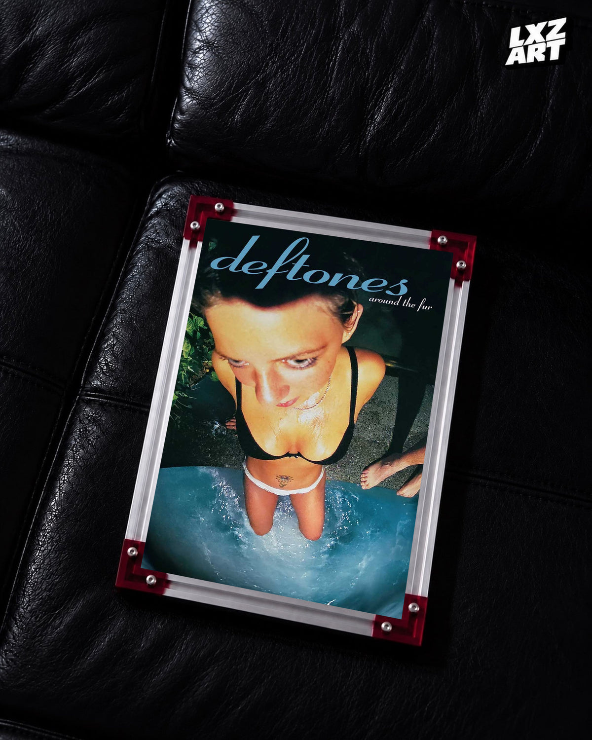 Deftones Around the Fur Blue Title Album Poster displayed on a black leather sofa in a red-corner frame; unframed print, frame not included