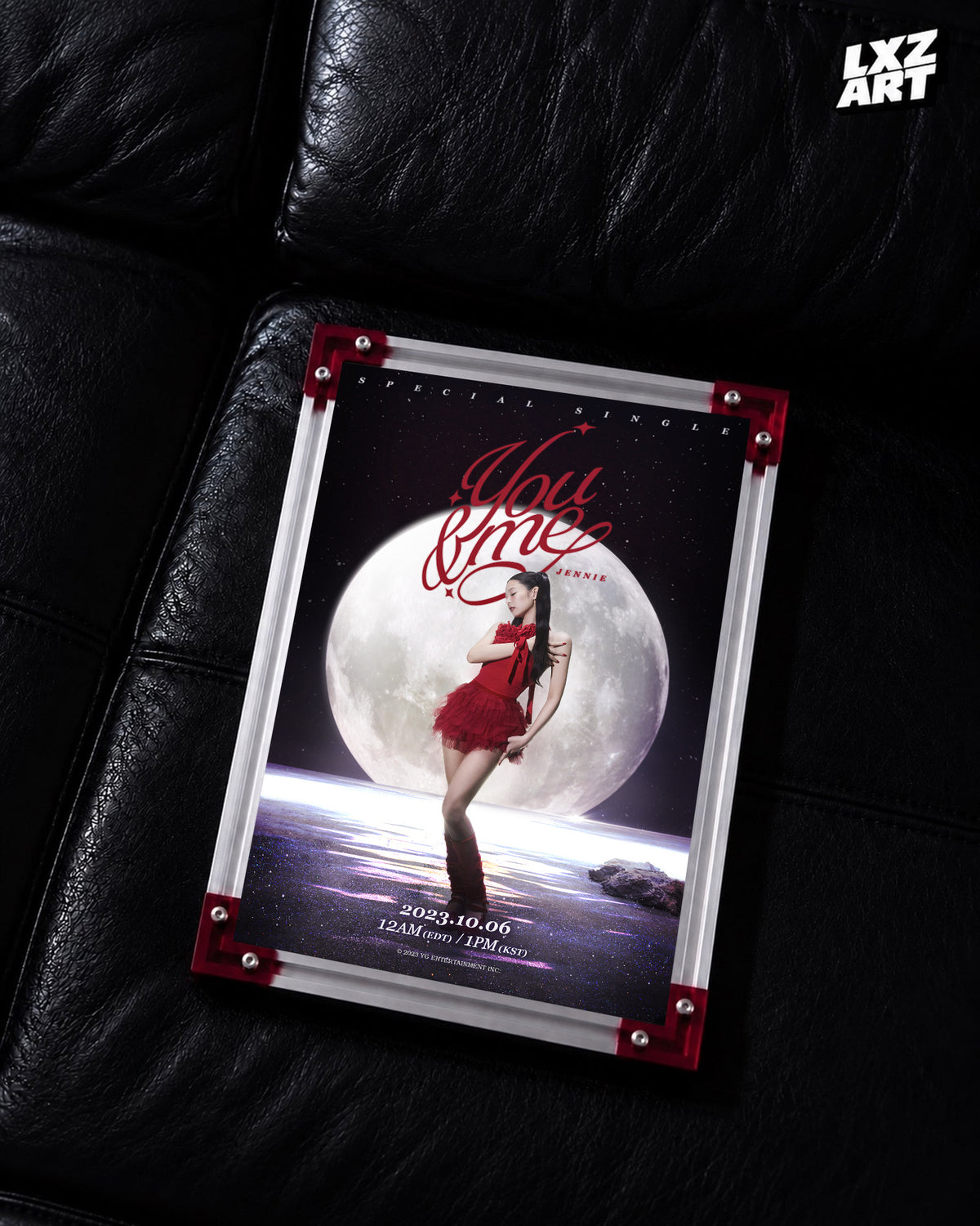 JENNIE You & Me moon title poster displayed on a black leather sofa in a red-corner frame; unframed print, frame not included