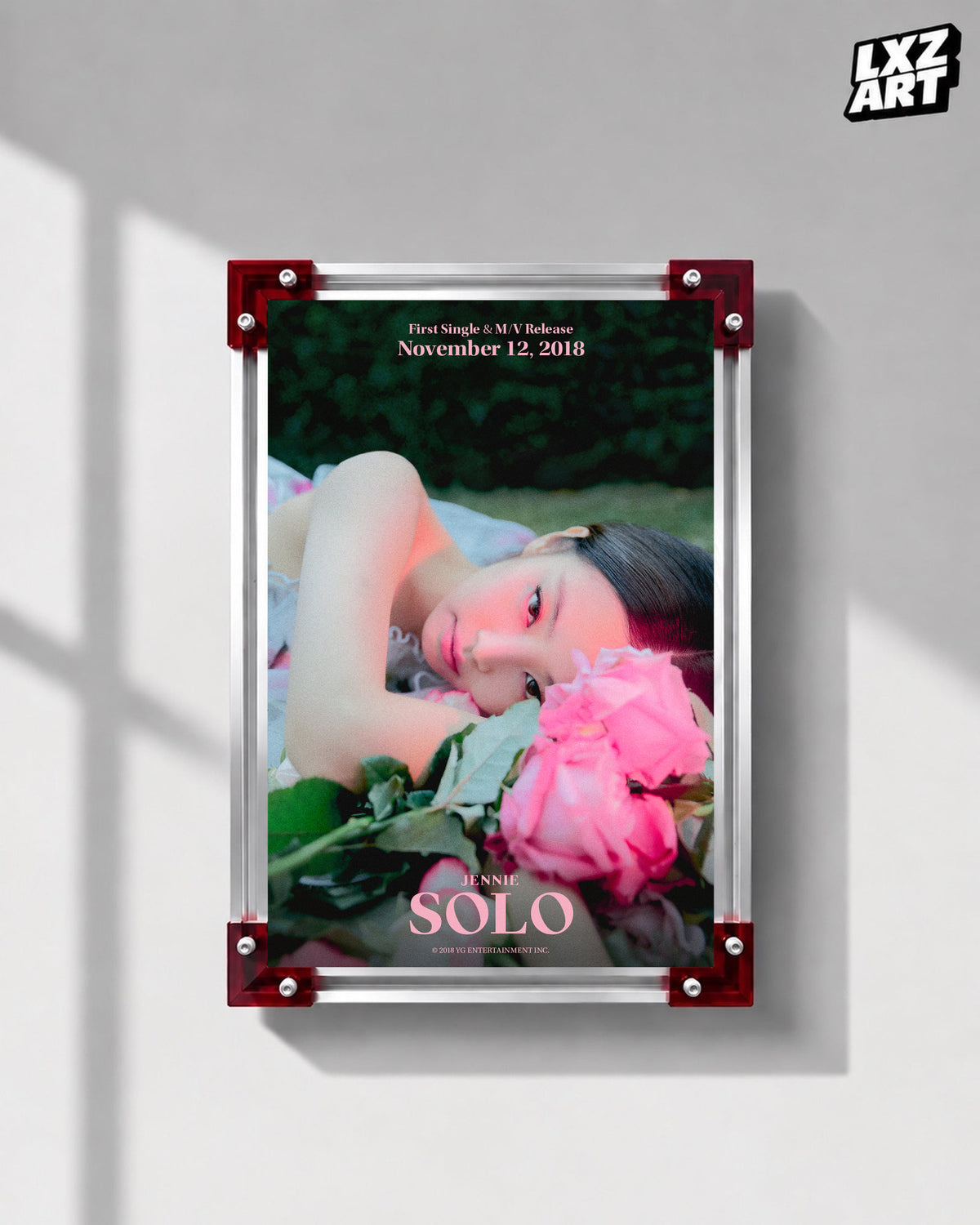 JENNIE SOLO pink rose teaser poster displayed on a gray wall in a red-corner frame; unframed print, frame not included