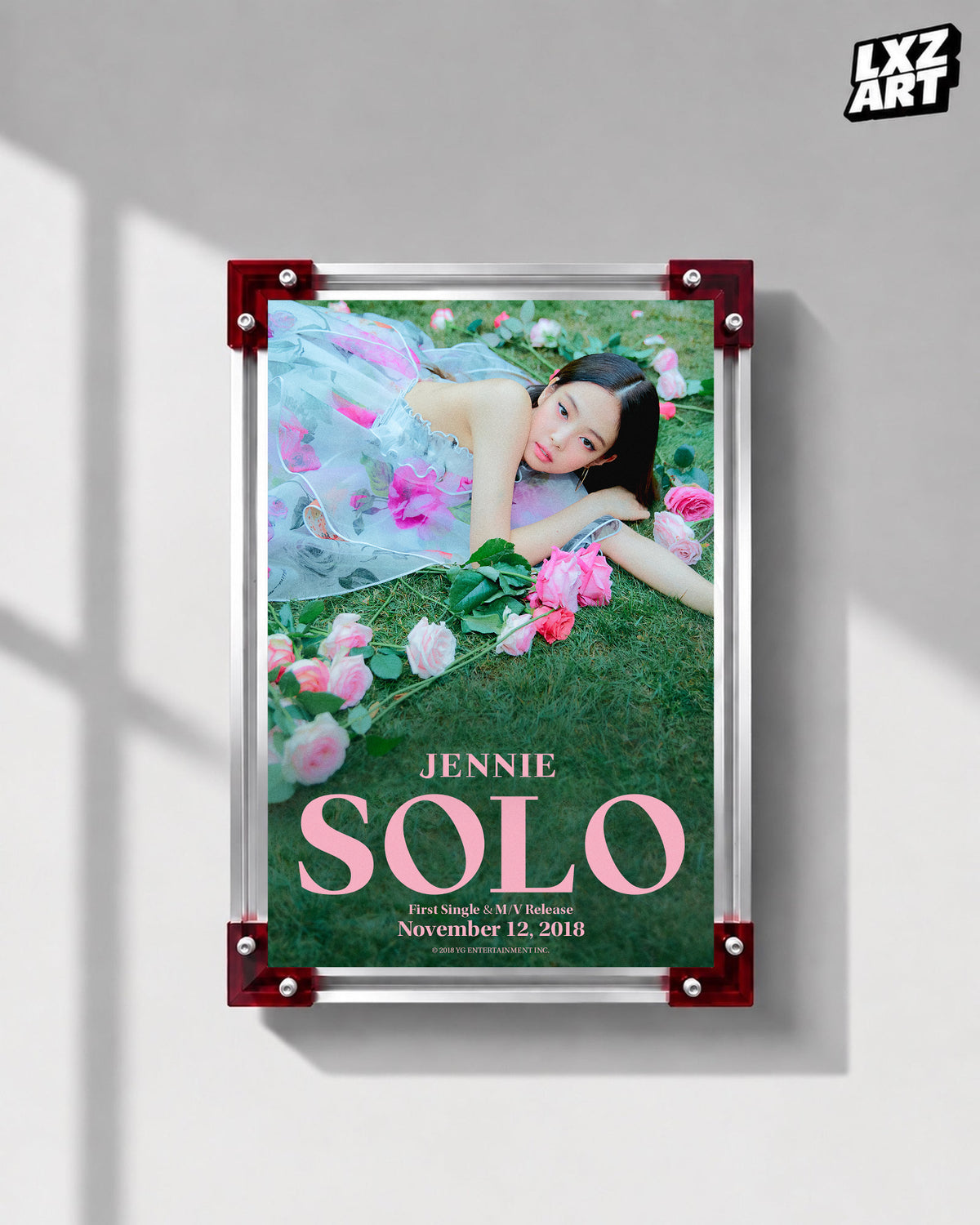 JENNIE SOLO garden teaser poster displayed on a gray wall in a red-corner frame; unframed print, frame not included