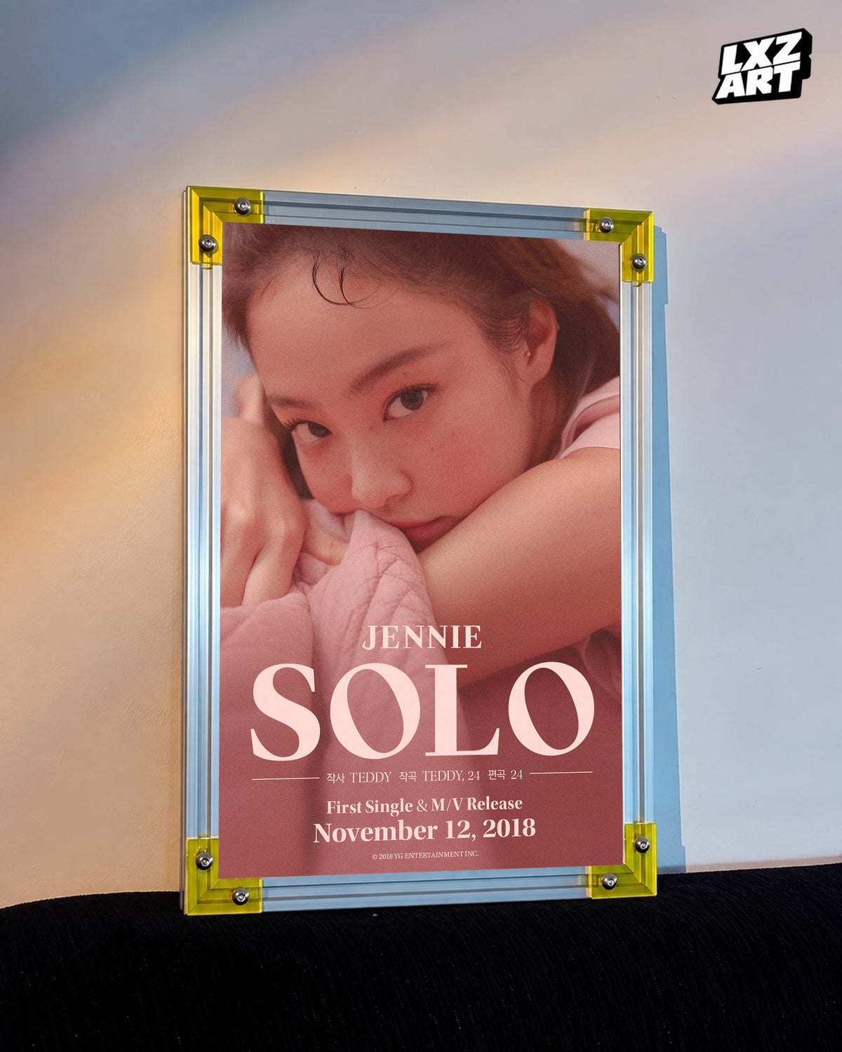 JENNIE SOLO blush credit poster displayed against a warm wall in a yellow-corner frame; unframed print, frame not included
