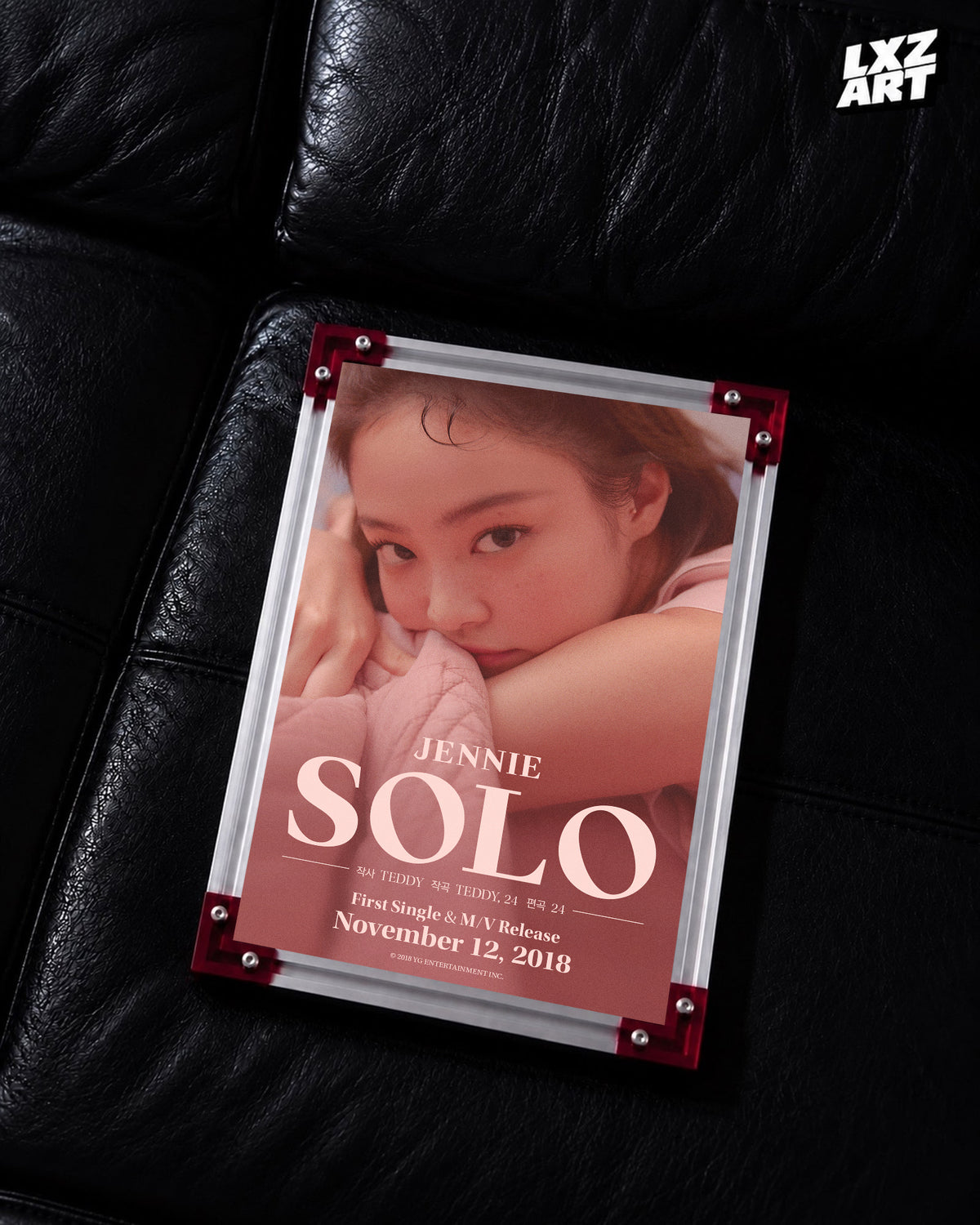 JENNIE SOLO blush credit poster displayed on a black leather sofa in a red-corner frame; unframed print, frame not included