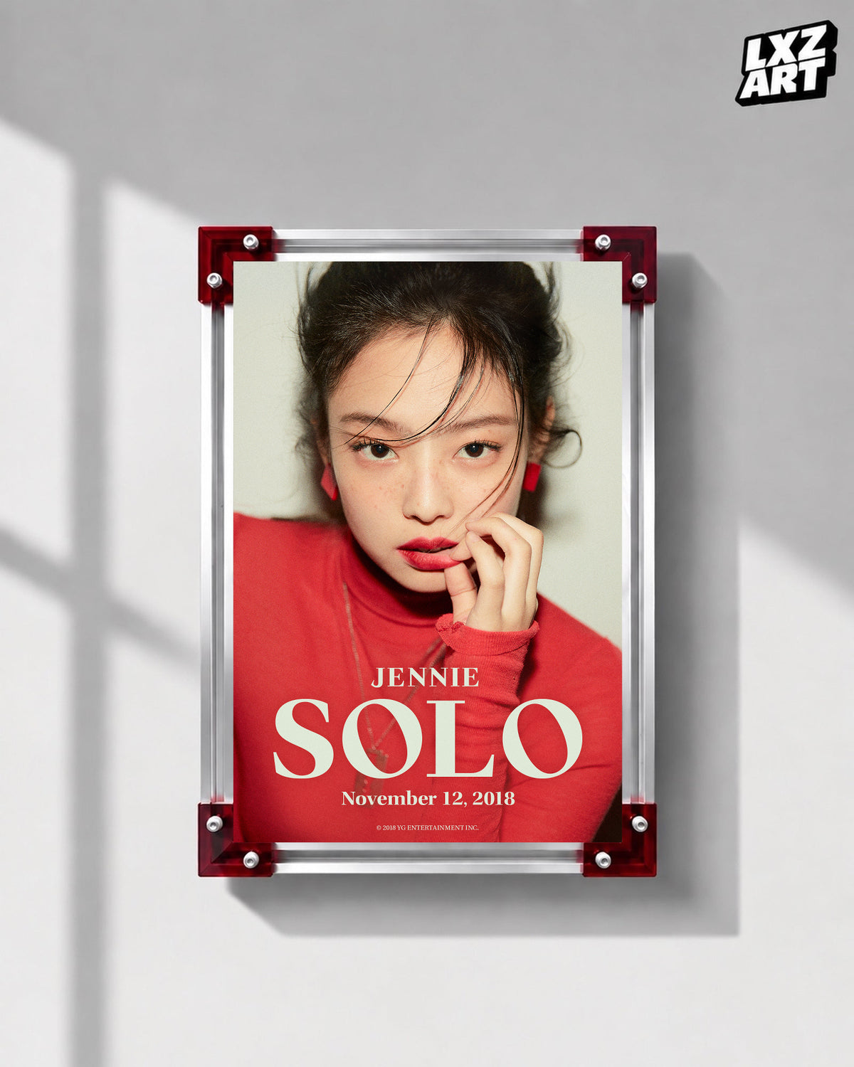 JENNIE SOLO red debut teaser poster displayed on a gray wall in a red-corner frame; unframed print, frame not included