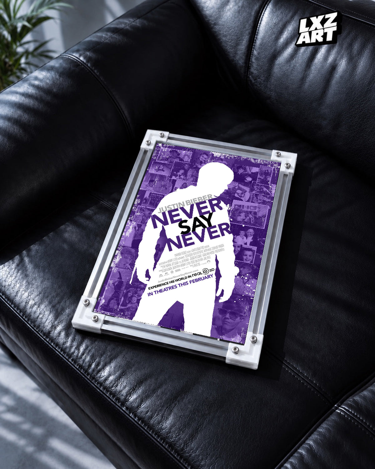 Justin Bieber Never Say Never Purple Collage Concert Film Poster displayed in a white-corner frame on a black leather sofa. Frame for display only.